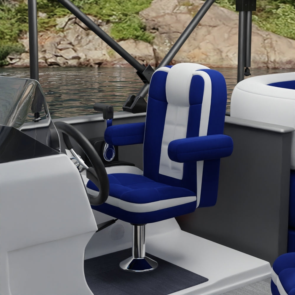 Captain chair upholstered in royal blue solid fabric on a pontoon boat, with padded armrests and a nearby steering wheel; water and a rocky shoreline in the background.
