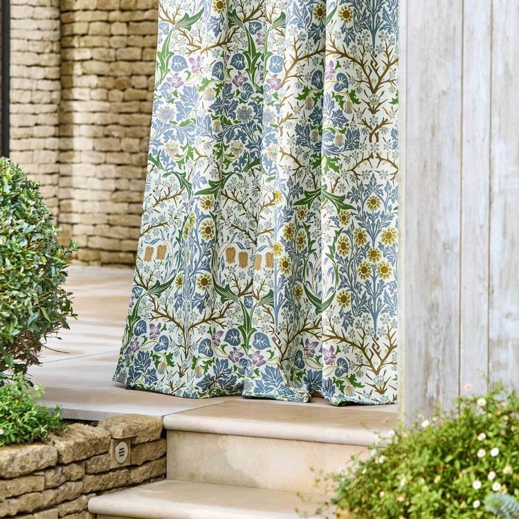 Blackthorn Weave Outdoor Fabric in Sky Blue by Morris & Co featuring a historic floral design by J.H. Dearle. Durable woven polypropylene performance fabric for indoor-outdoor upholstery, cushions, pillows, drapery, and furniture. Weather-resistant textured weave ideal for coastal, traditional, and high-traffic residential or commercial décor projects.