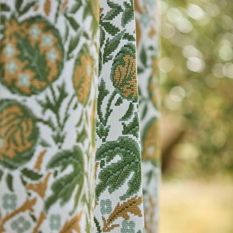 Morris & Co Elmcote Weave Outdoor fabric in Moss/Wheat with a detailed pattern of seed heads and foliage on a durable 53.5" wide indoor/outdoor textile, ideal for cushions, drapery, or patio upholstery.