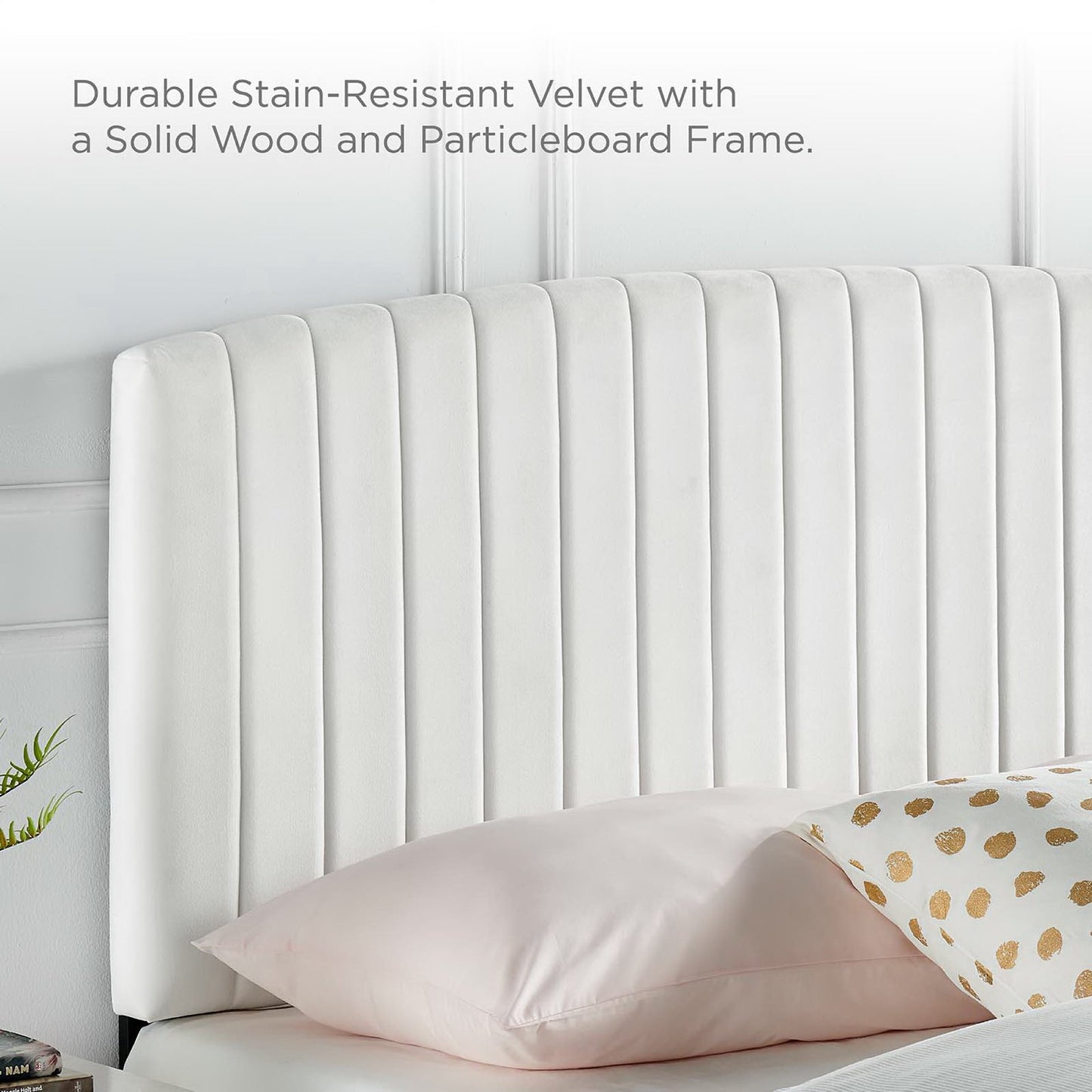 White velvet upholstered twin headboard with vertical channel tufting.