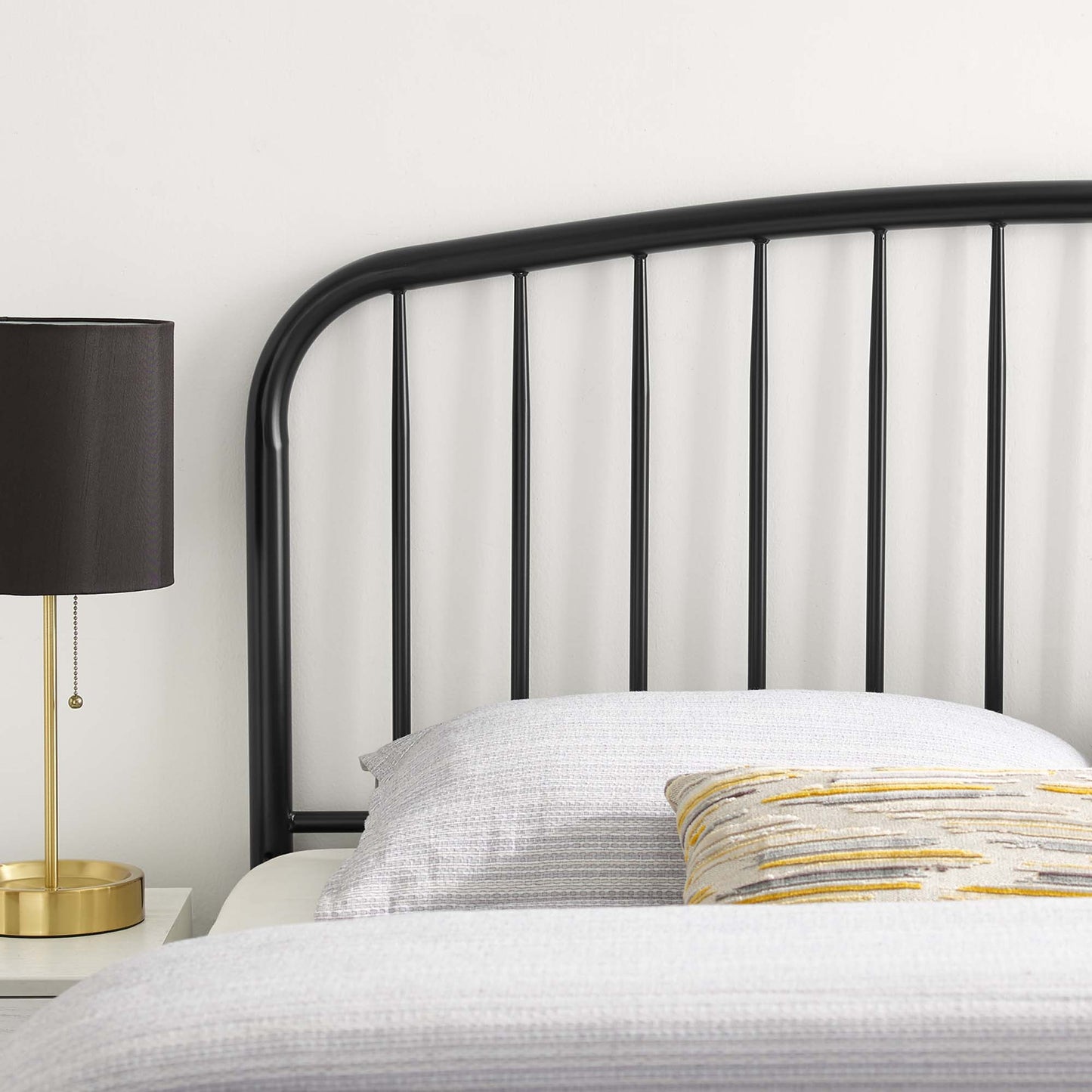 Black metal twin headboard with tall slatted design.