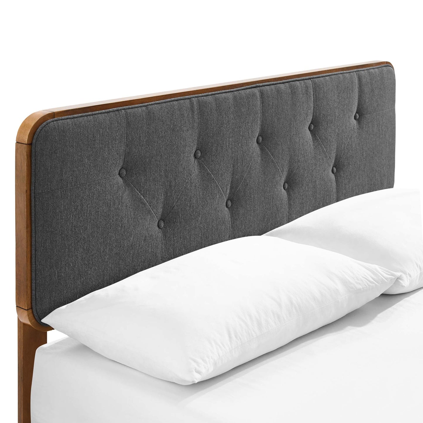 Walnut wood full platform bed with splayed legs; white bedding visible.