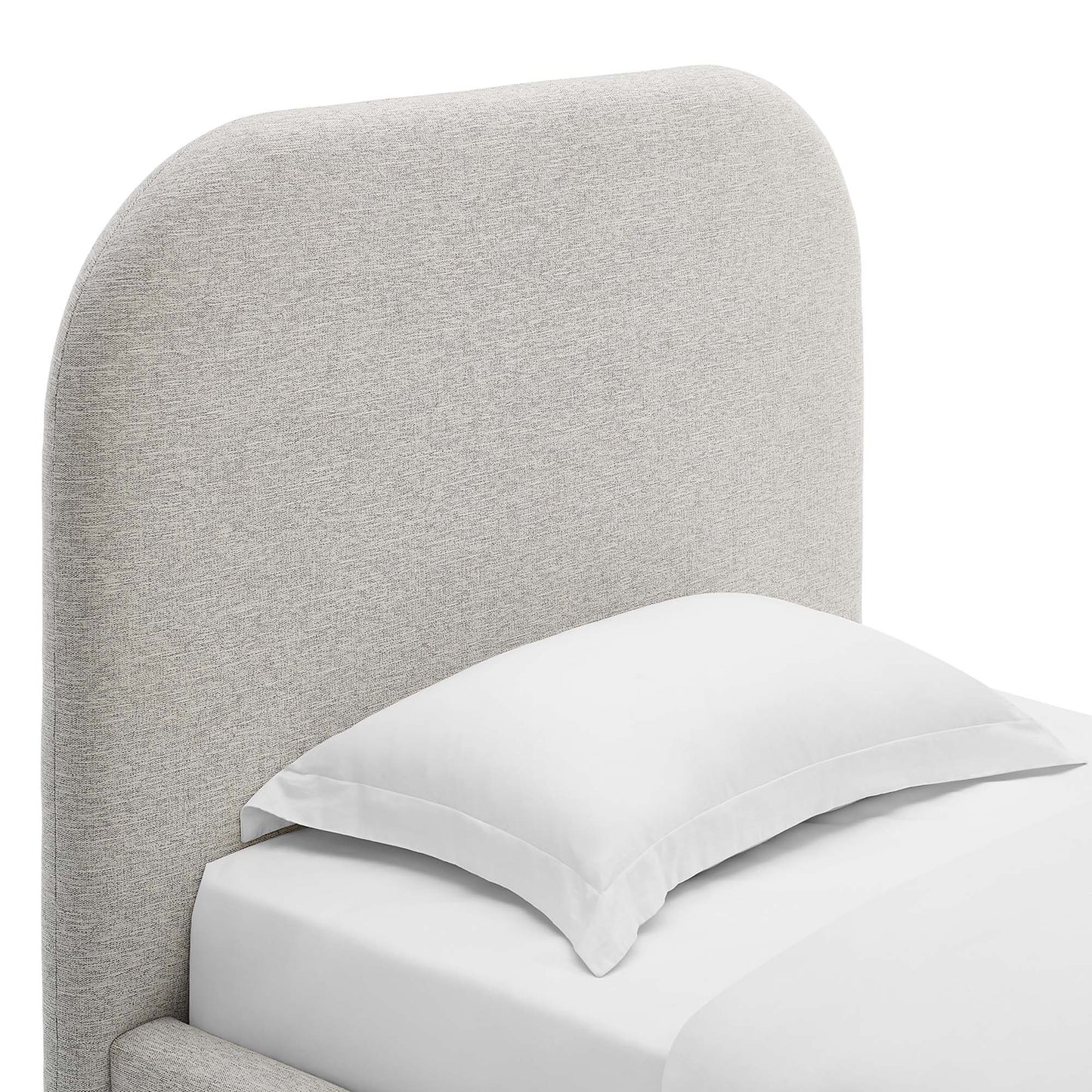 Light gray fabric upholstered curved headboard bed with white pillow and sheets.