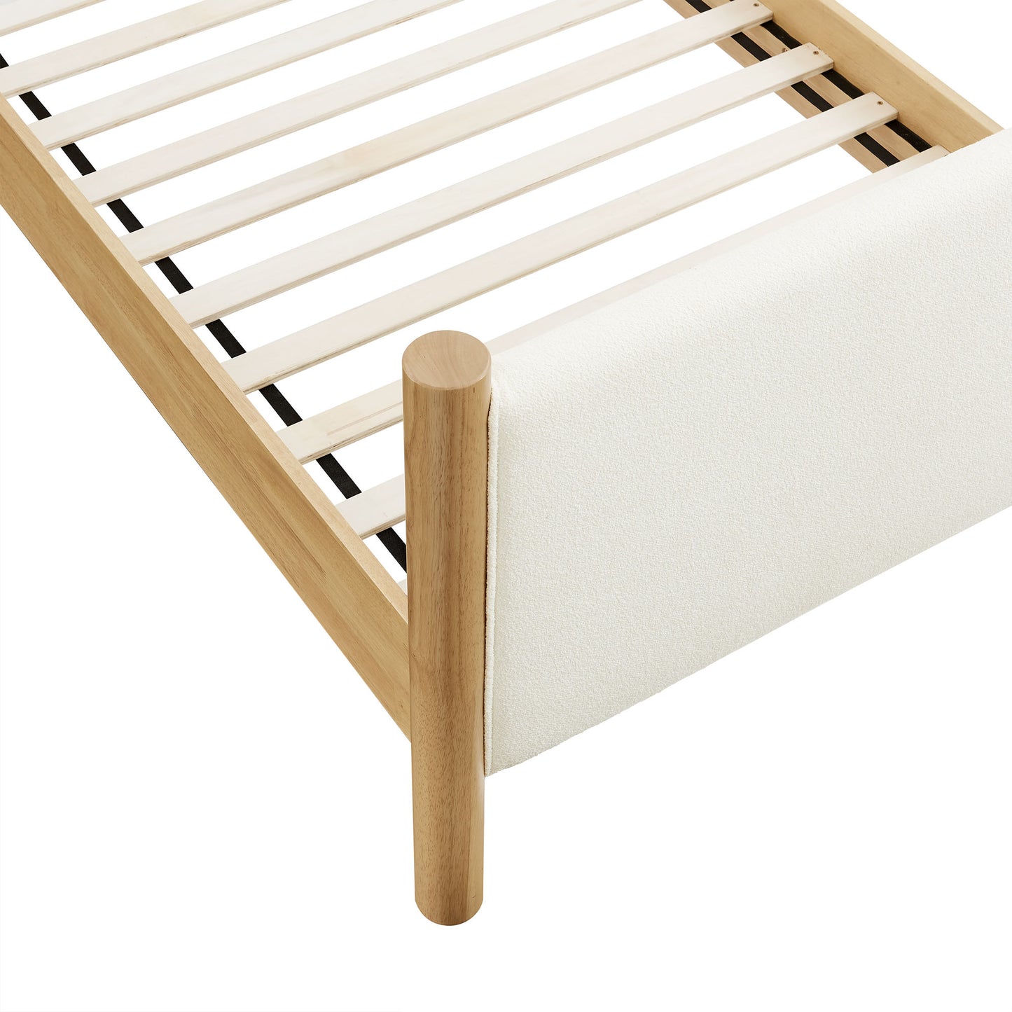 Light oak bed frame with slatted base and cream fabric footboard panel.