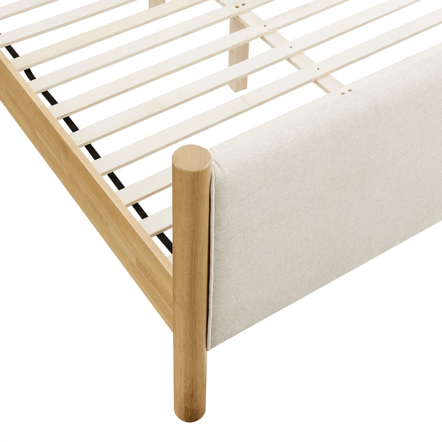 Ivory fabric-upholstered platform bed with a slatted base.