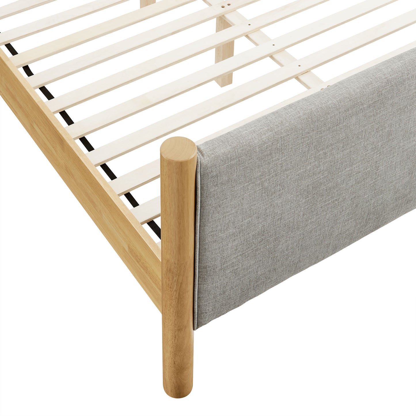 Oatmeal fabric upholstered queen-size platform bed with a low-profile frame.