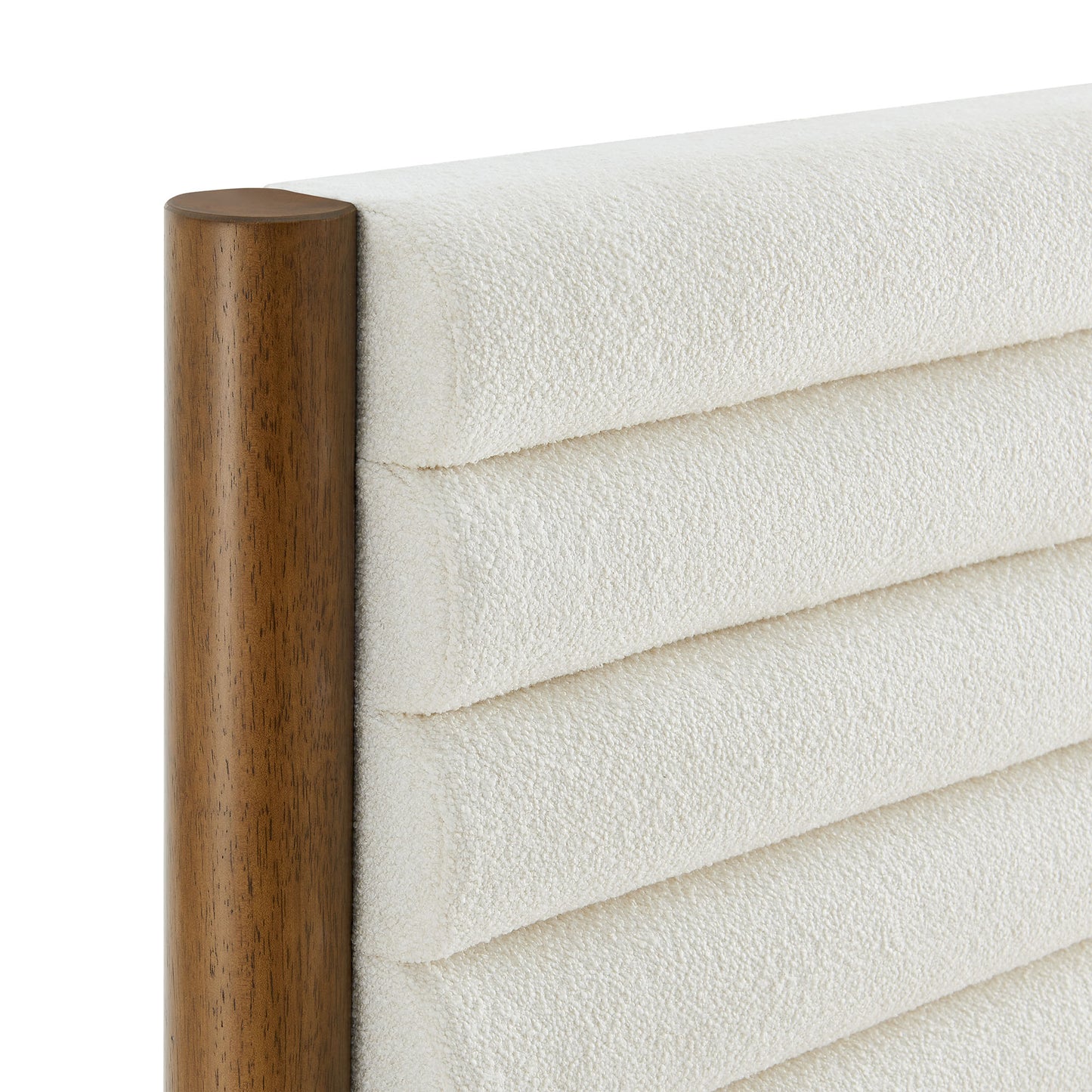 White quilted fabric headboard with horizontal channel stitching and walnut wood posts, part of a twin platform bed.