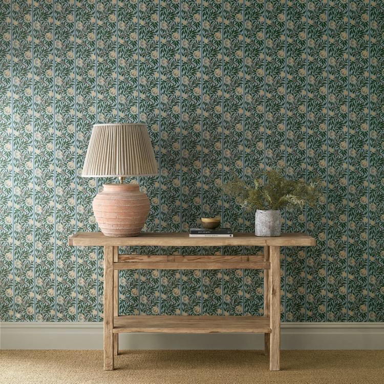 Peony Trellis wallpaper by Morris & Co in soft blue and nettle tones, surface-printed with climbing trellis and stylized peony florals forming a subtle ogee pattern, luxury designer wallpaper for bedrooms, living rooms, and feature walls.