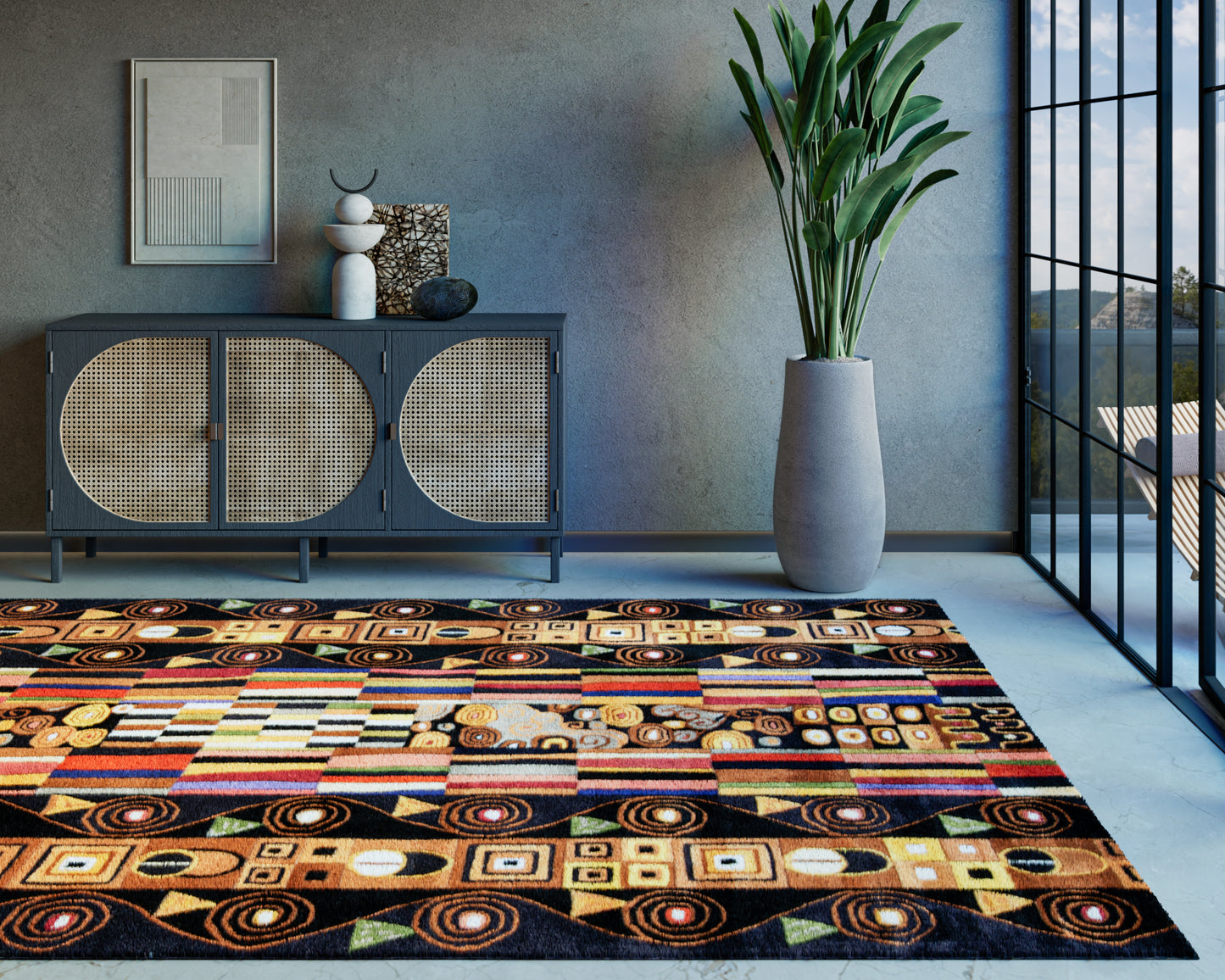 Colorful geometric area rug with circles and squares in orange, yellow, teal and black; black rattan-panel cabinet, tall plant in gray pot.