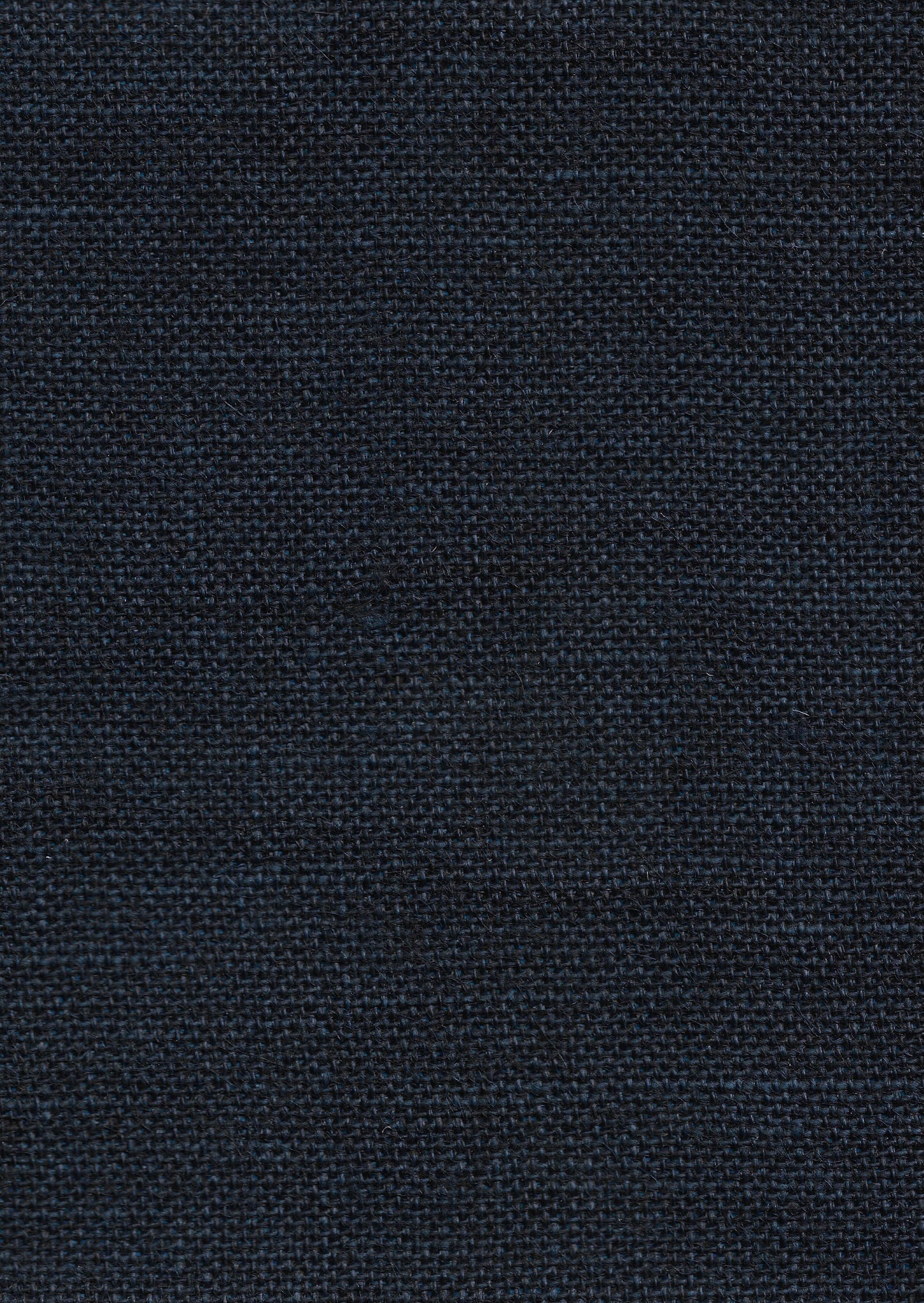 Close-up of dark navy knitted fabric texture.