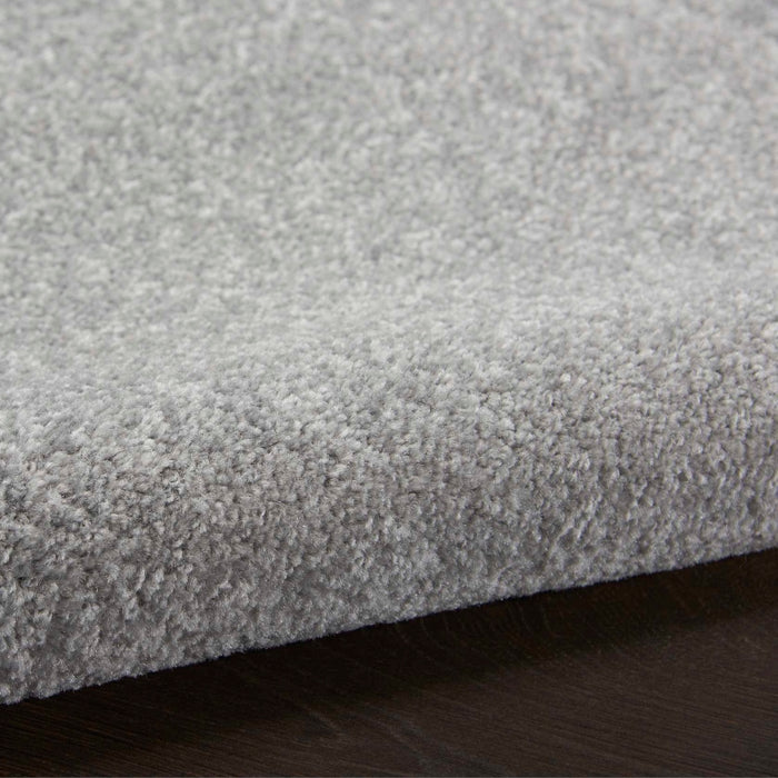Nourison Essentials 8x10 silver grey indoor outdoor area rug, modern solid grey polypropylene rug with low pile texture, durable easy clean rug for living room dining room patio deck balcony, contemporary neutral area rug for minimalist modern and transitional home decor.