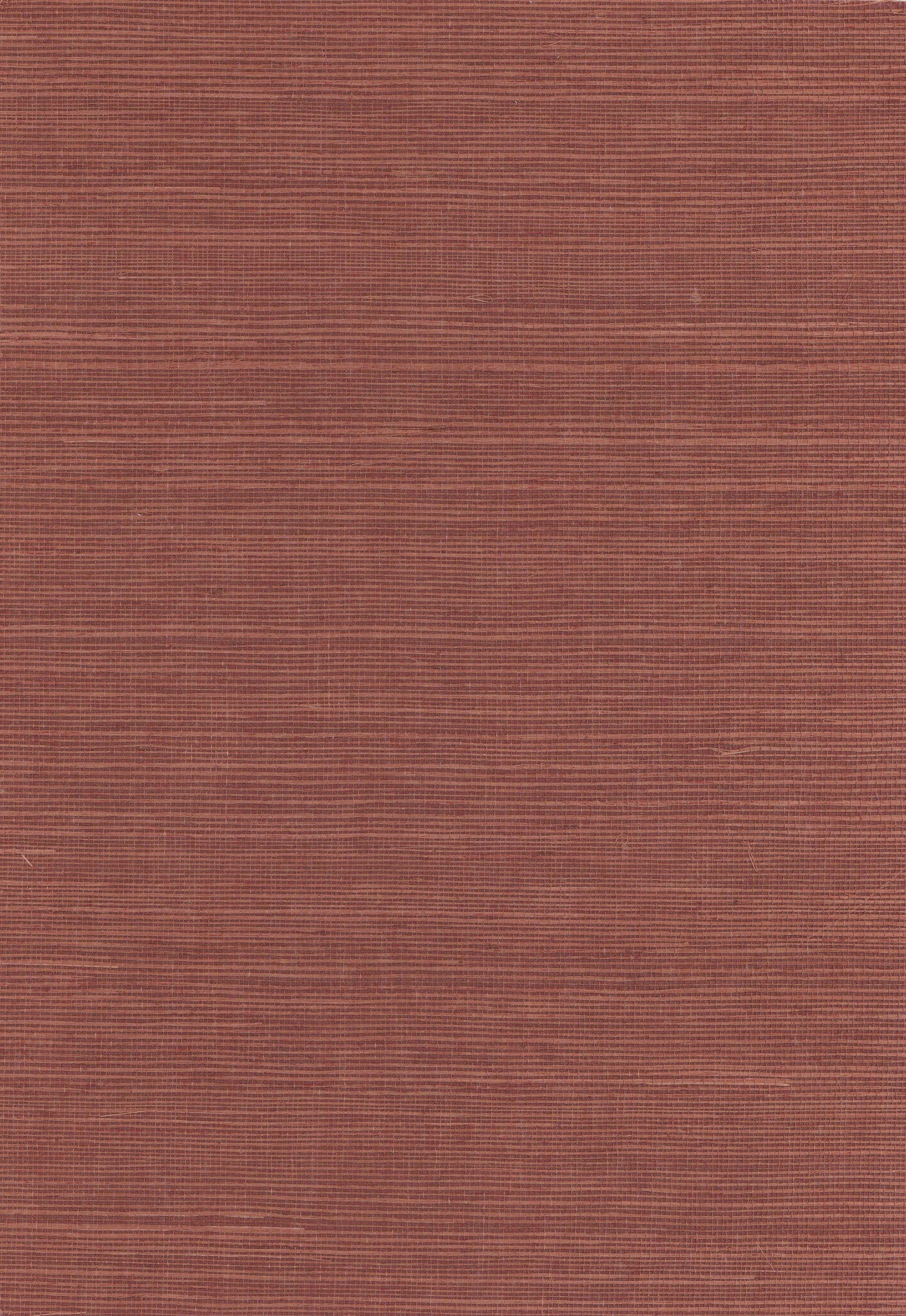 Rust-red textured fabric swatch with subtle horizontal ridges, woven upholstery or clothing material.