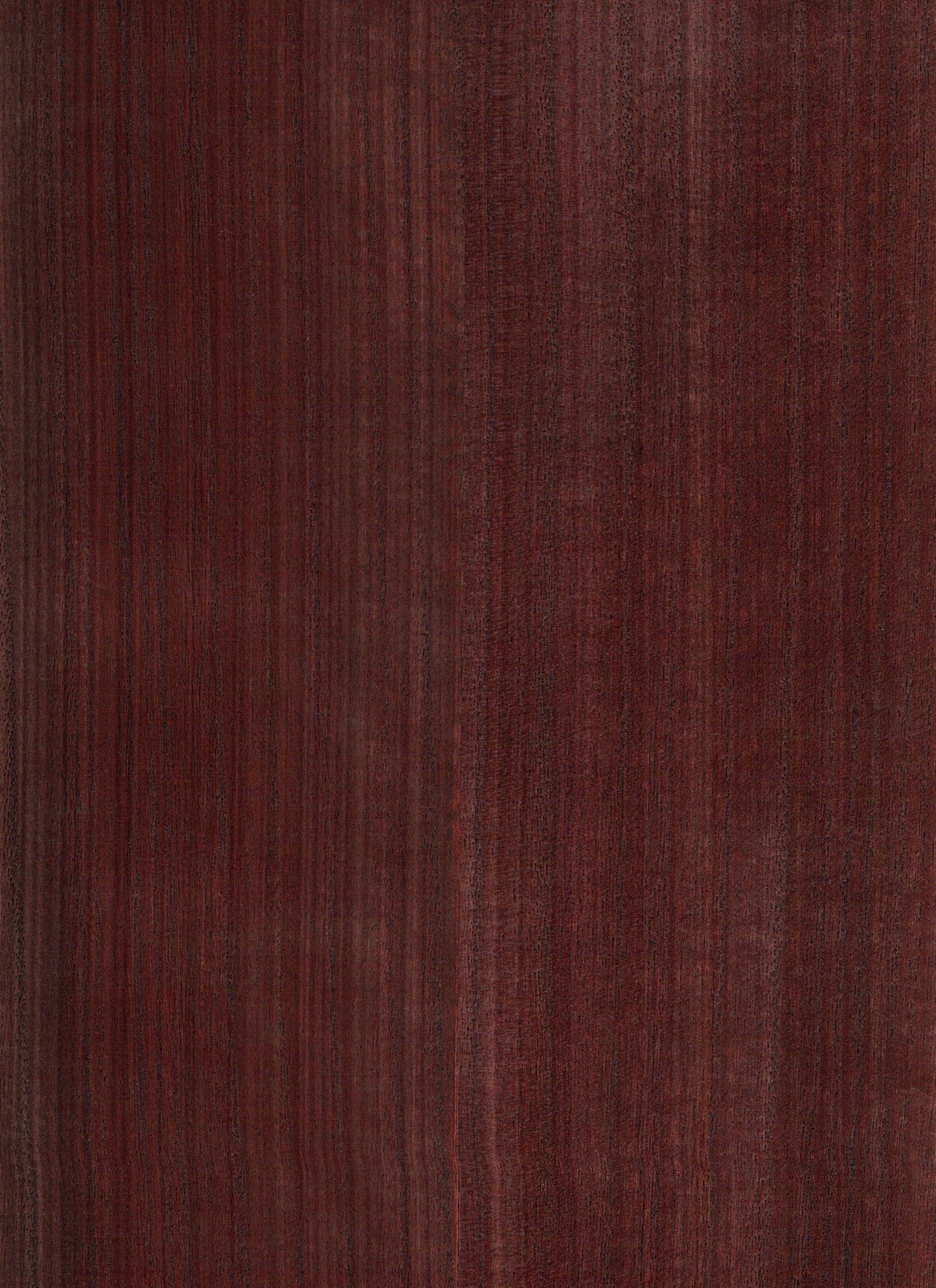 Dark reddish-brown mahogany wood panel with vertical grain and smooth finish.