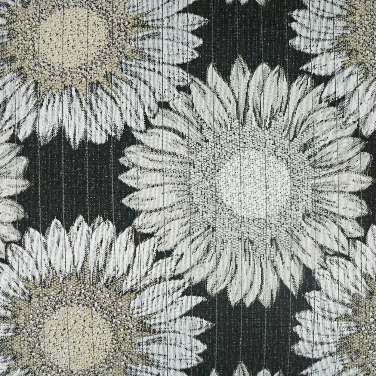 Outdoor lumbar pillow featuring a black daisy-chain floral pattern.