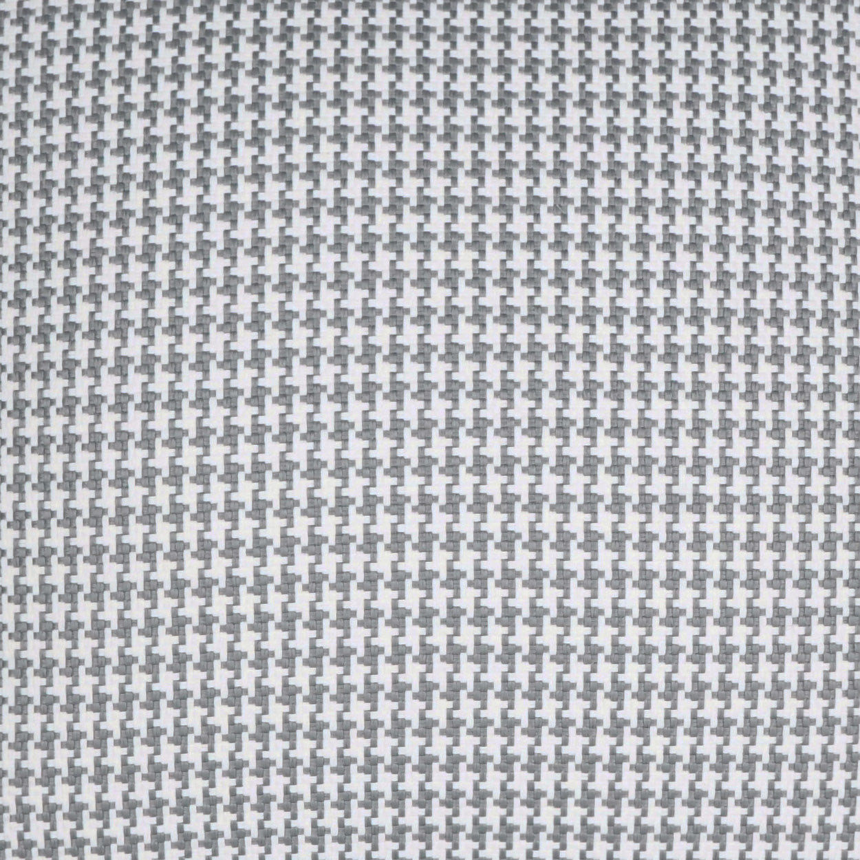 Grey and white houndstooth pattern on a 12" x 24" outdoor lumbar pillow, stone-colored, traditional style.