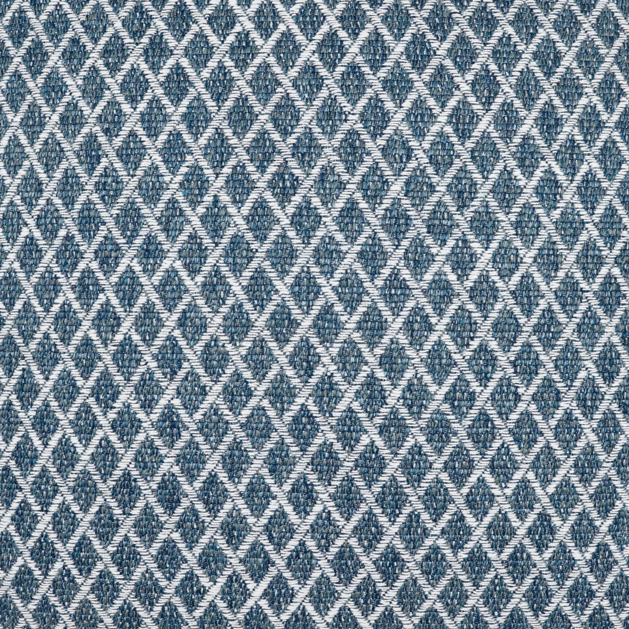 Blue and white diamond lattice fabric on a 22" x 22" outdoor pillow with a textured weave.