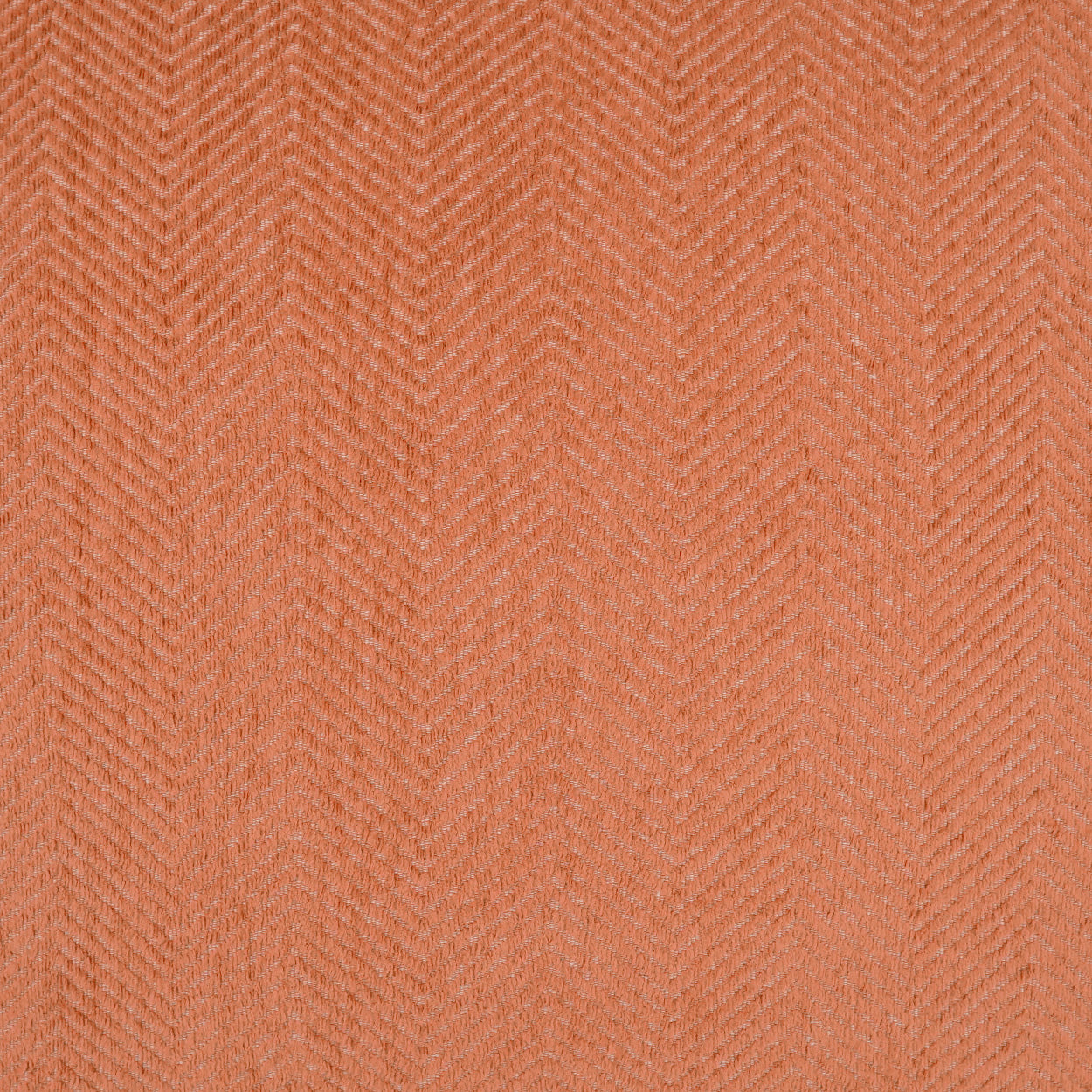 Outdoor 12 x 24 inch lumbar pillow with adobe chevron pattern in warm peach-orange tones.