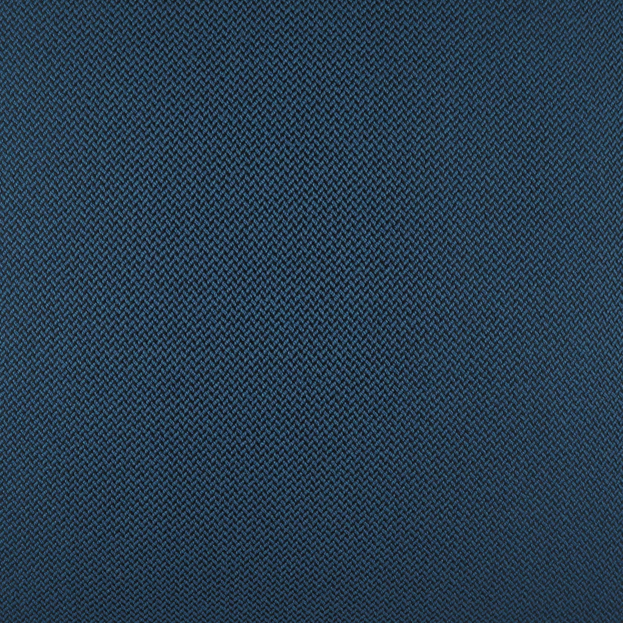 Close-up of navy blue twill fabric with tight diagonal weave; durable textile texture.