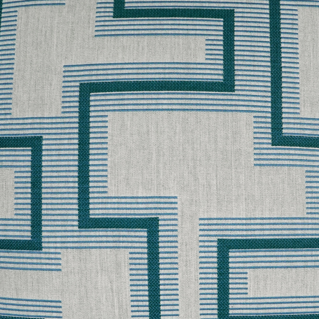 Maze-like teal borders with thin blue lines on light gray woven fabric; geometric upholstery pattern.