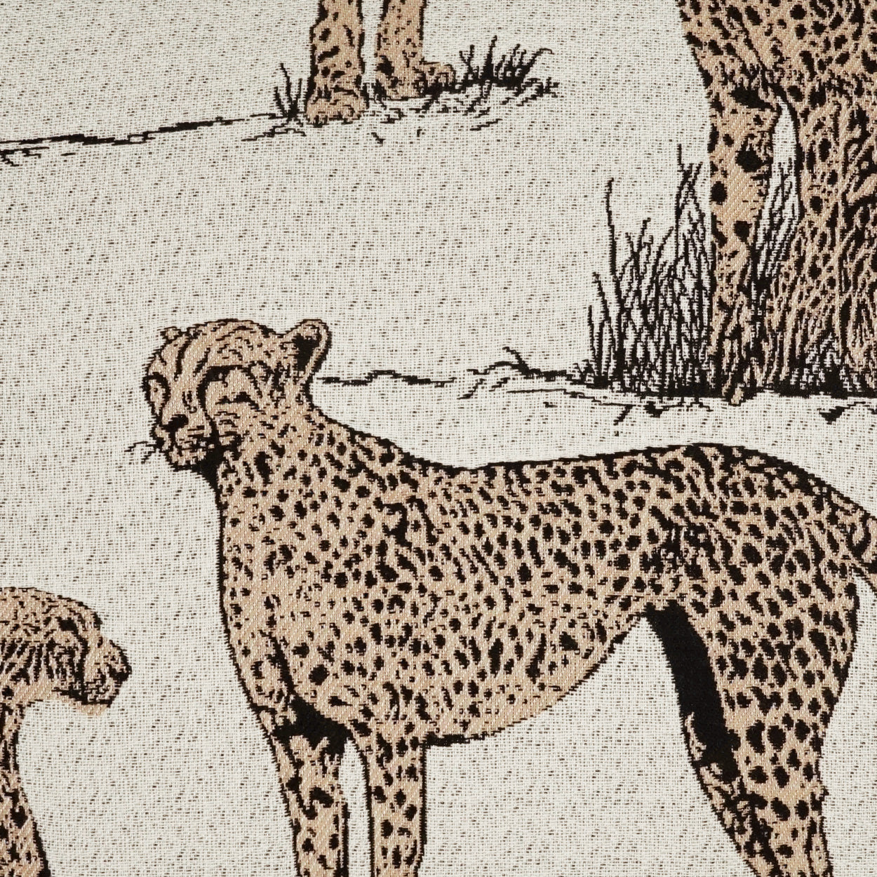 Beige fabric print showing a leopard and cub in a savannah, tan coats with black spots, vintage illustration style.