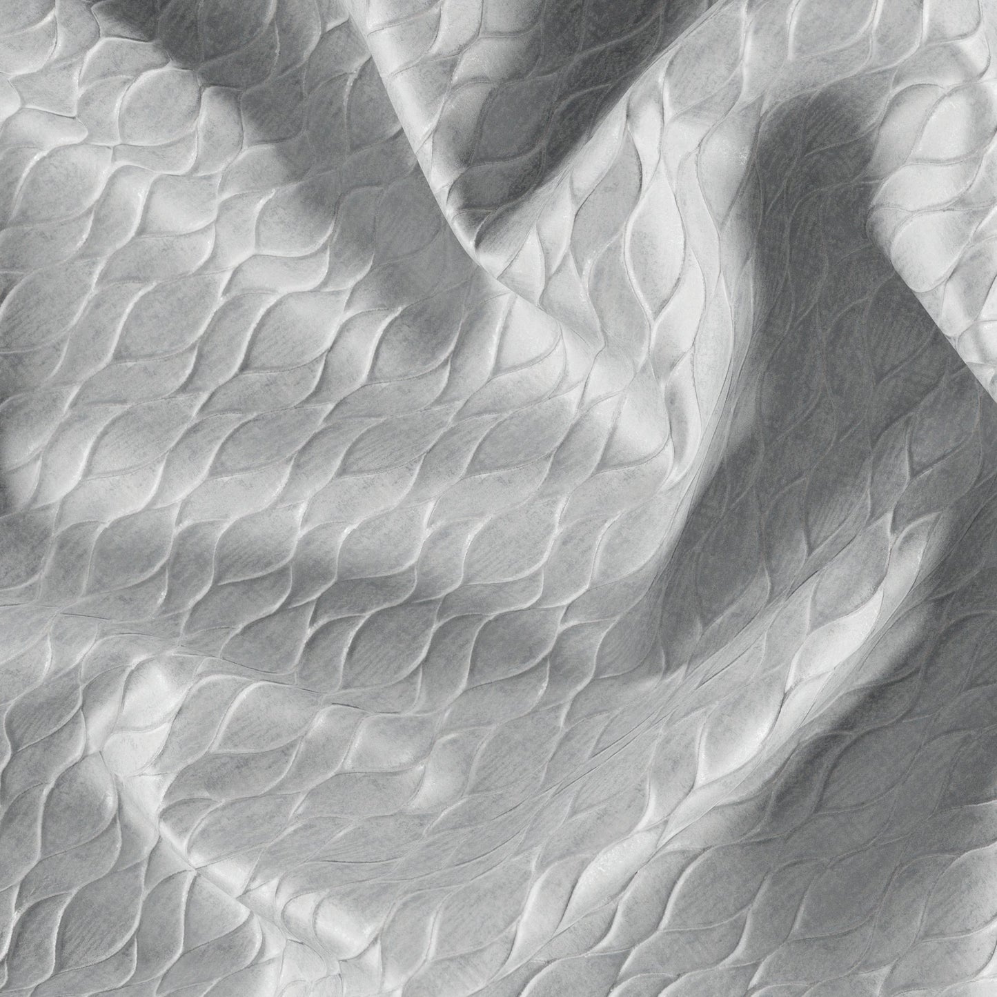 Close-up of metallic cream and silver jacquard fabric with an abstract ogee pattern and subtle texture.