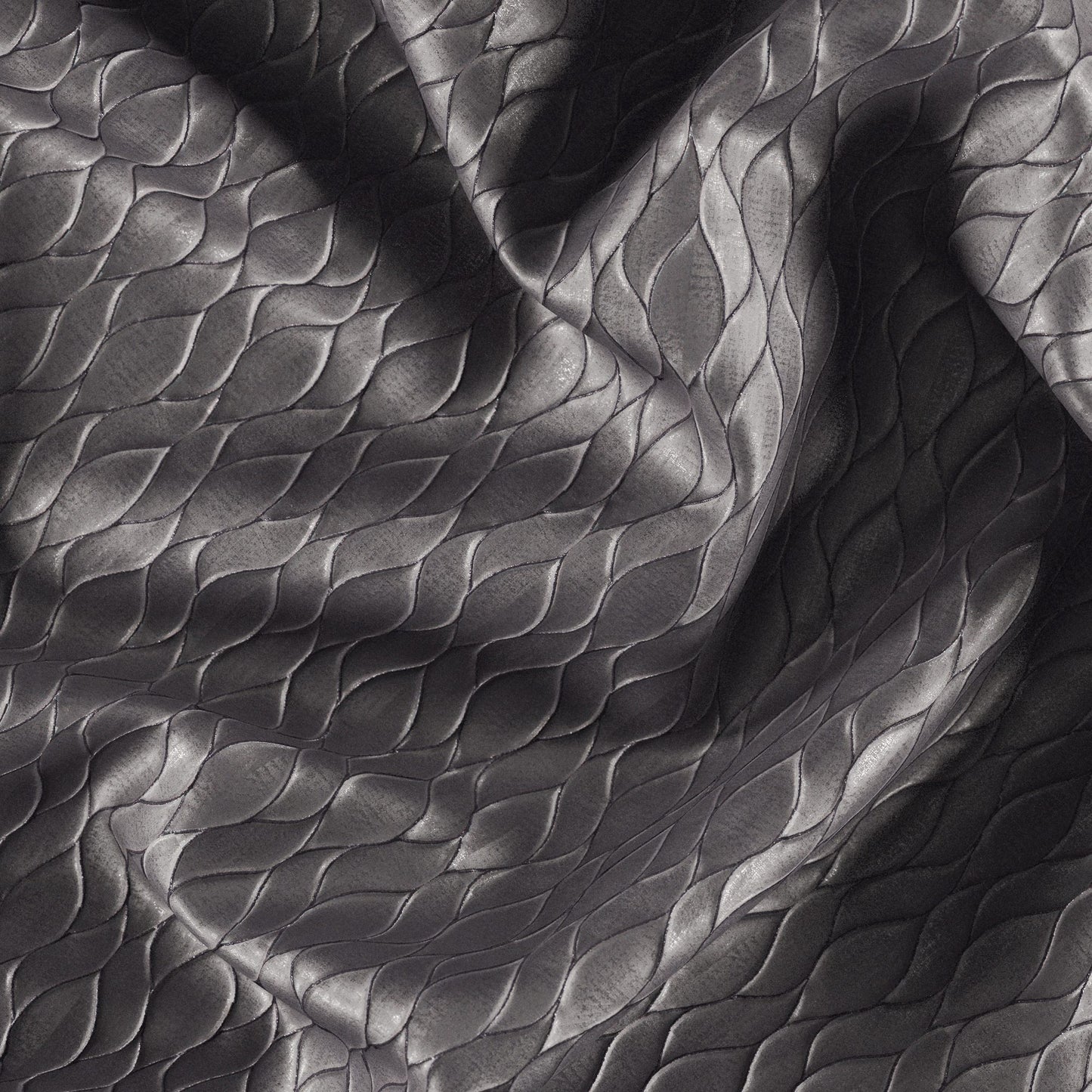 Dark gray jacquard fabric with metallic pewter sheen and abstract ogee pattern, shown in flowing folds.