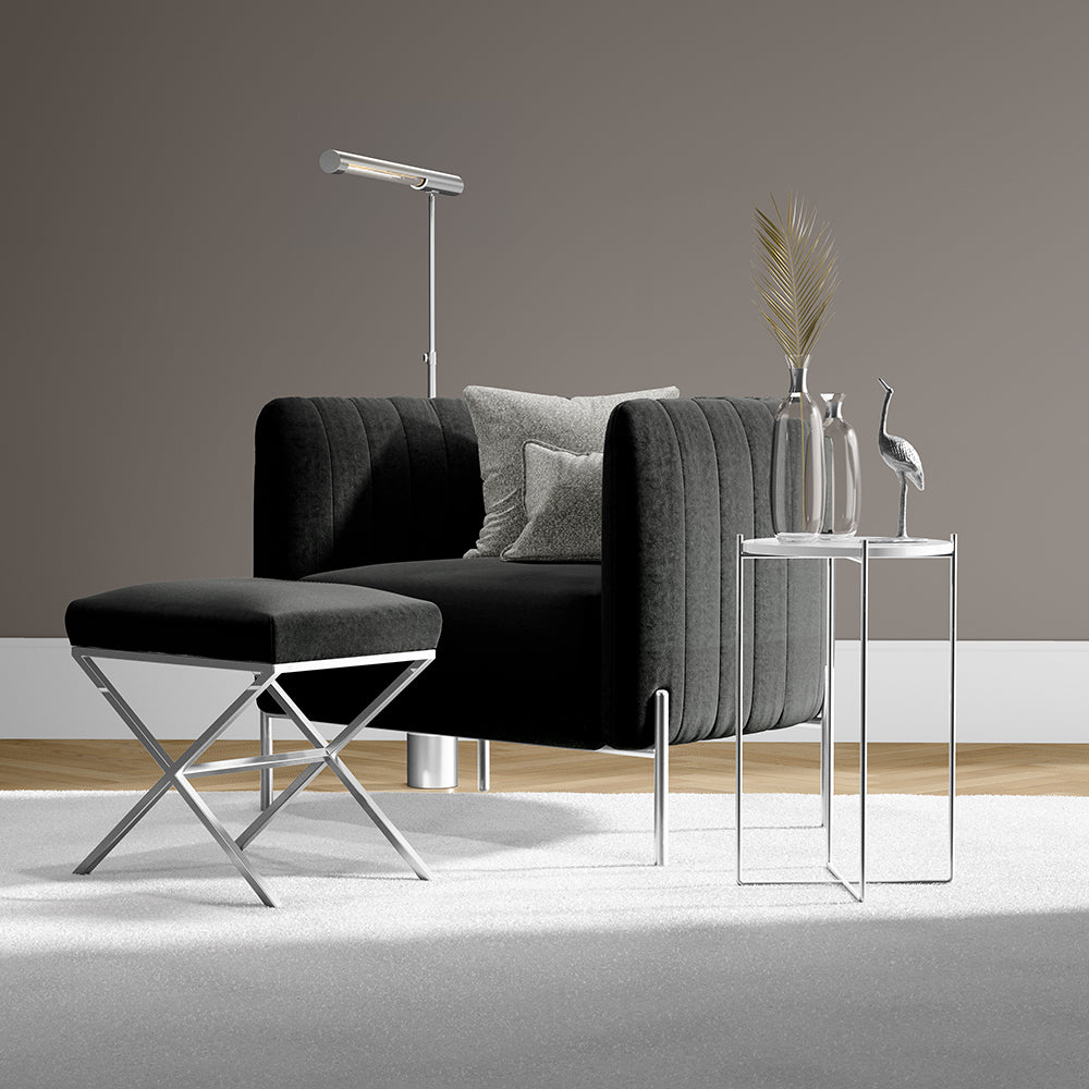 Pine solid fabric seating with a matching ottoman, glass-top tables, and a floor lamp in a neutral living room.