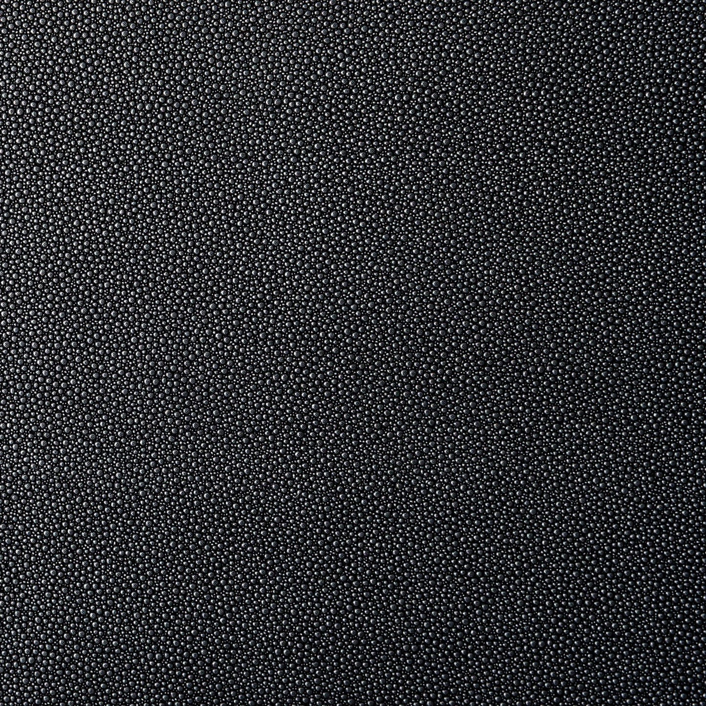 Dark black and grey textured vegan leather (vinyl) fabric.