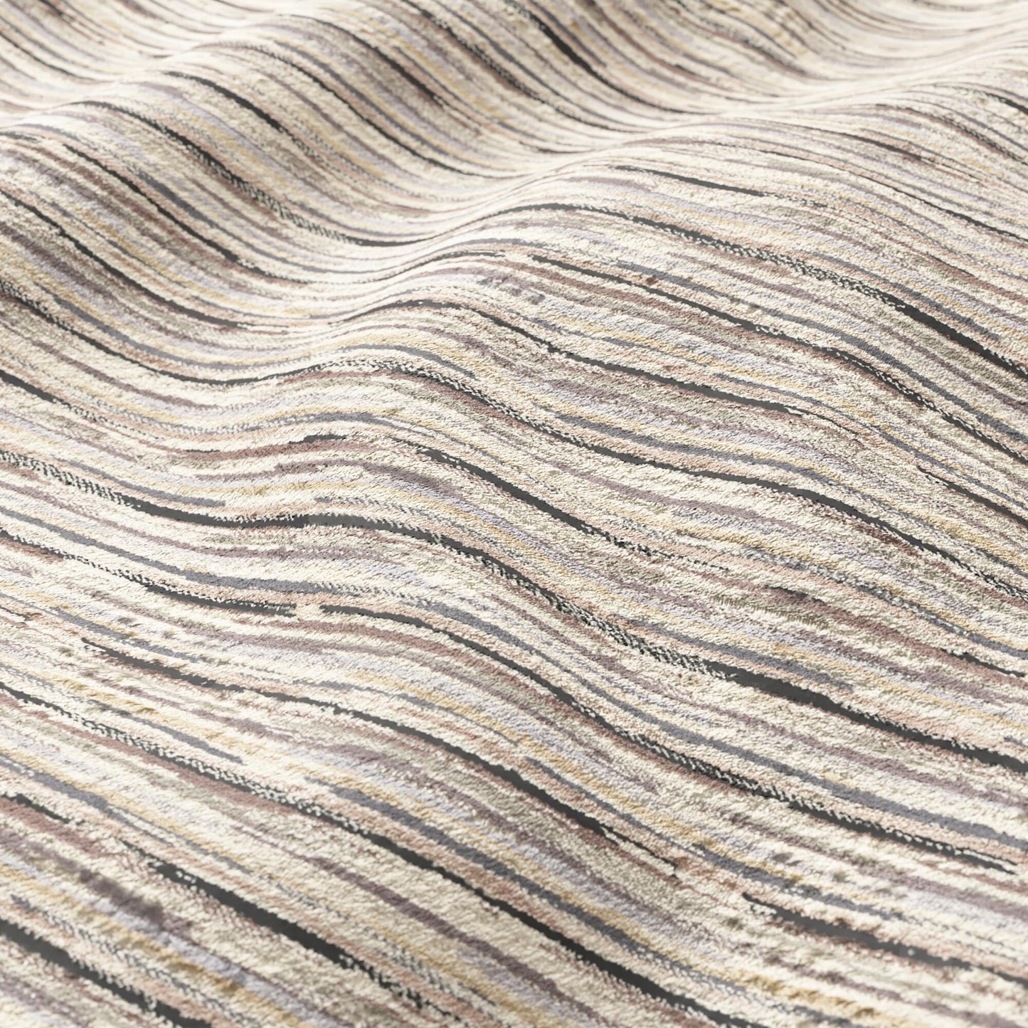 Beige striped fabric with cream and taupe wavy ridges, a textured textile for modern or coastal decor.