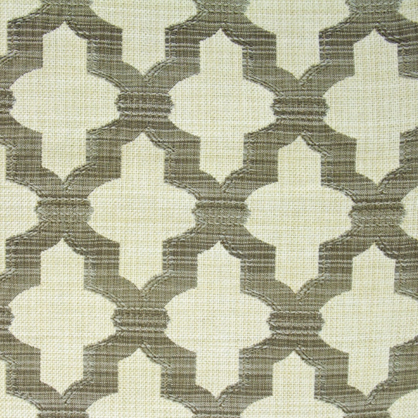 Cream and taupe woven fabric with interlocking quatrefoil lattice pattern and linen texture.