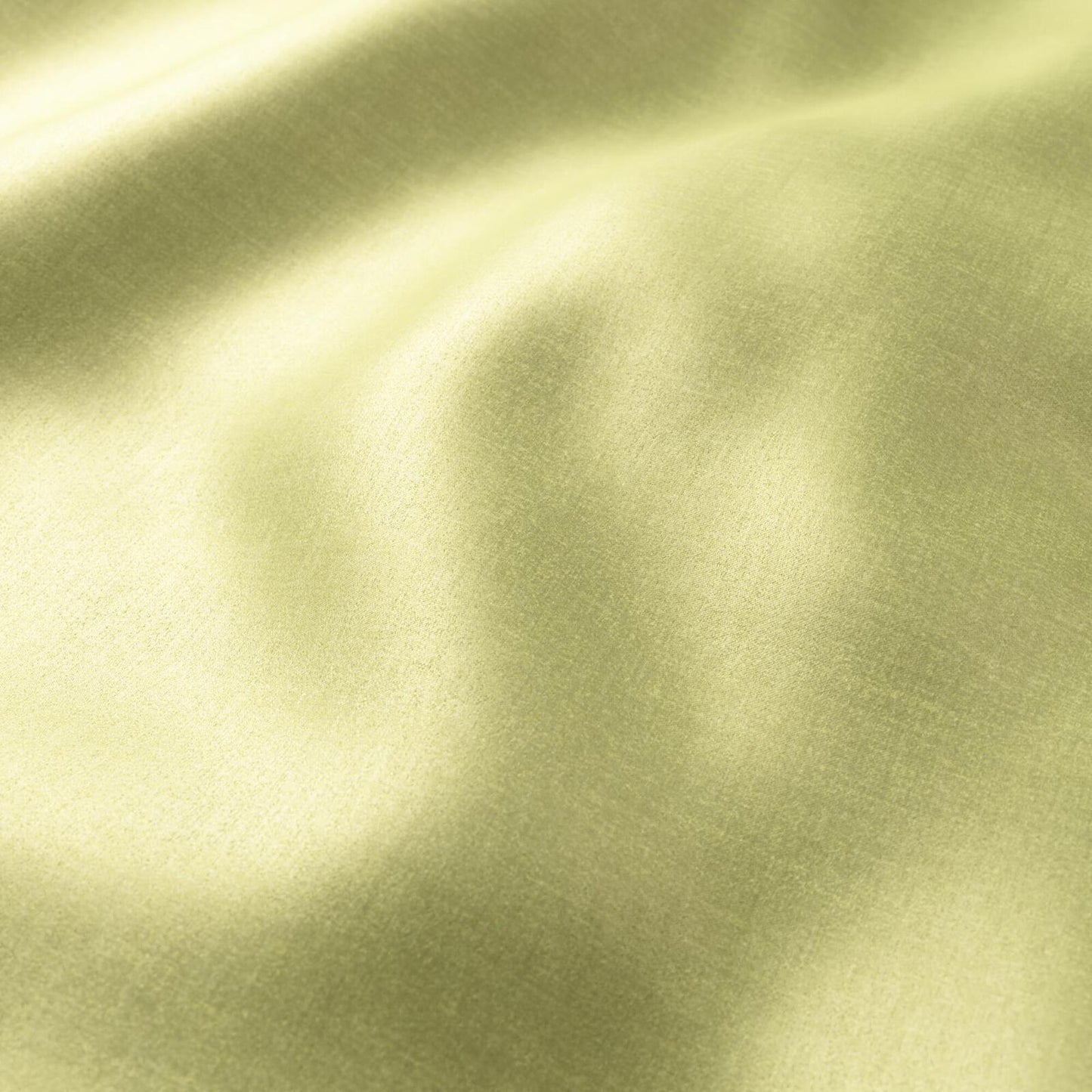 Polished pear green sateen fabric with soft folds and a glossy sheen.