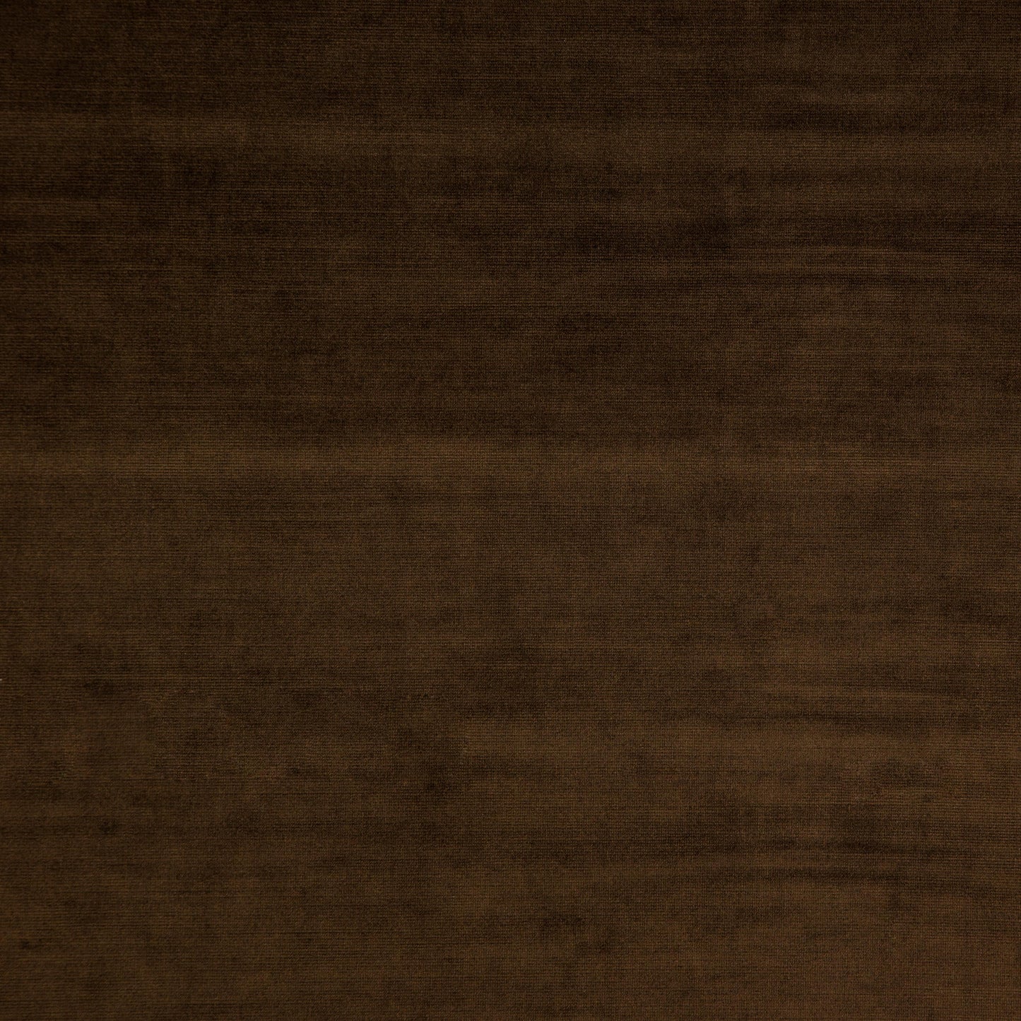 Plain brown velvet fabric swatch with a soft, plush pile.