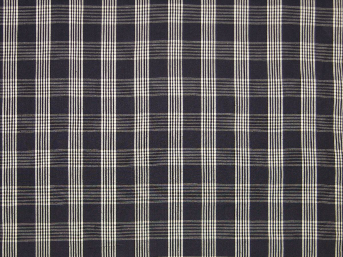 Navy blue plaid fabric with thin white stripes forming a classic check pattern.