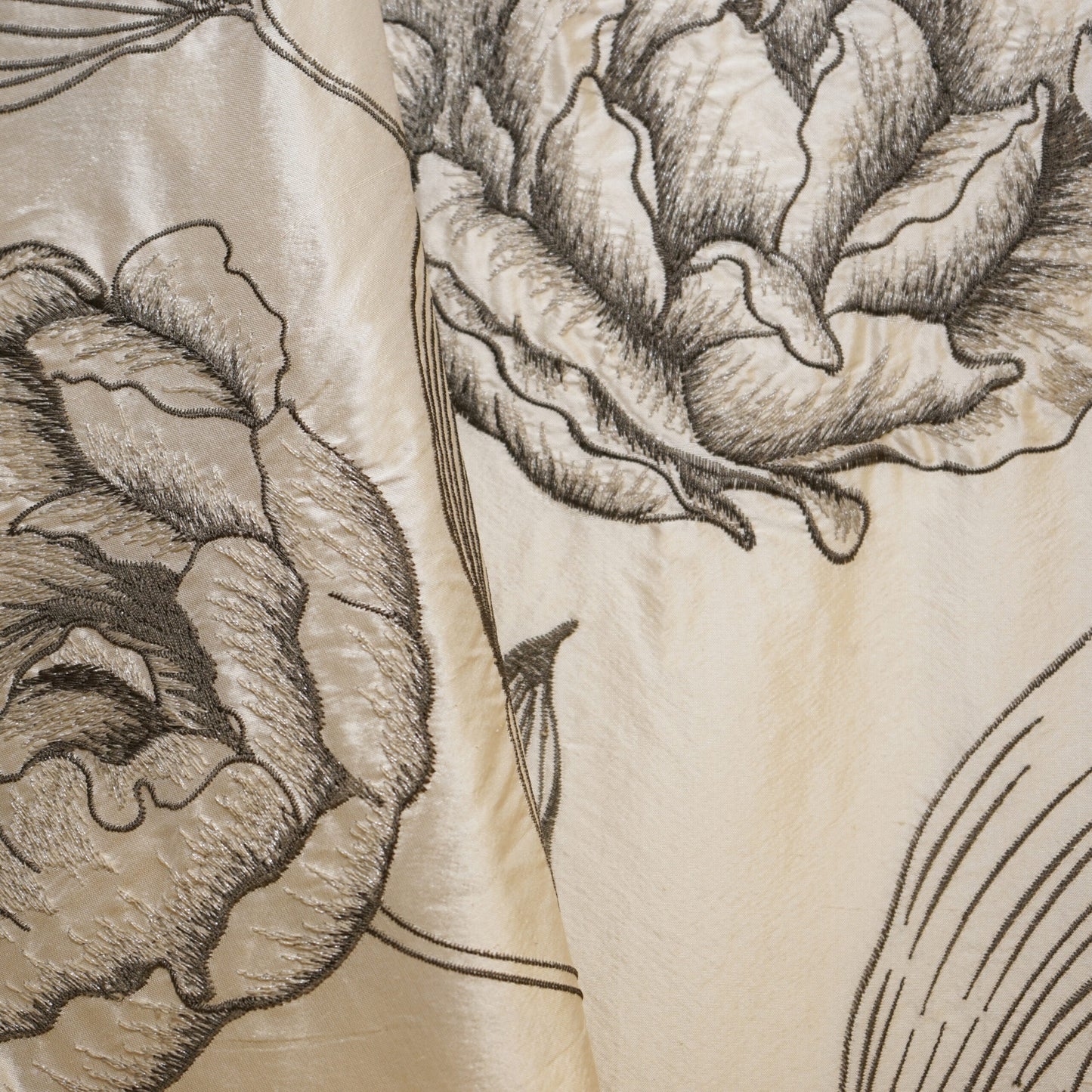 Cream fabric with large gray primrose floral print, hand-drawn botanical textile design.