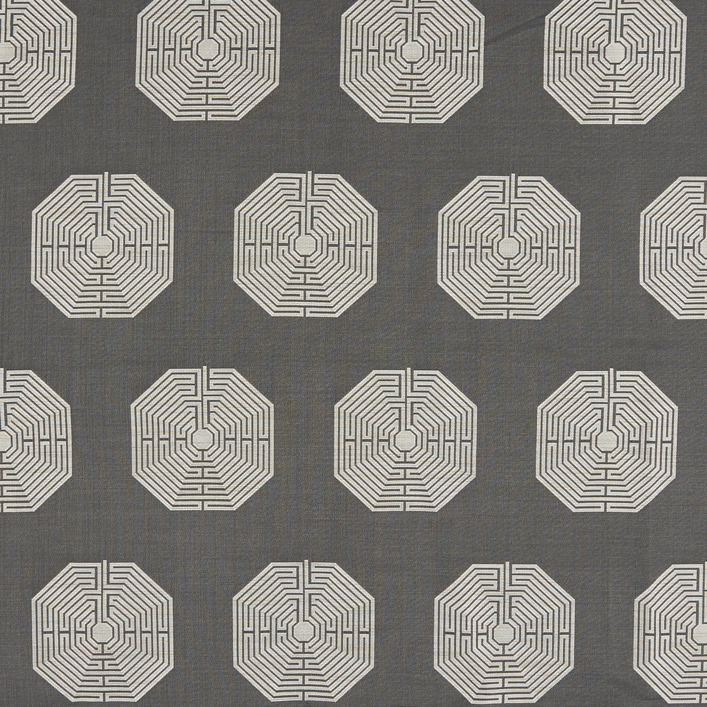 Charcoal gray fabric with repeating ivory octagon maze patterns; modern geometric textile for upholstery or drapery.