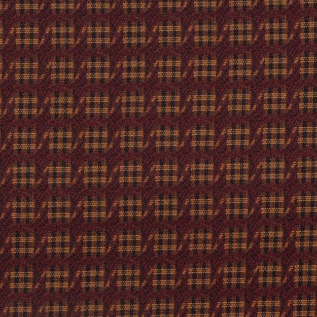 Close-up of burgundy and red check jacquard woven fabric; a plaid textile suitable for apparel or upholstery.