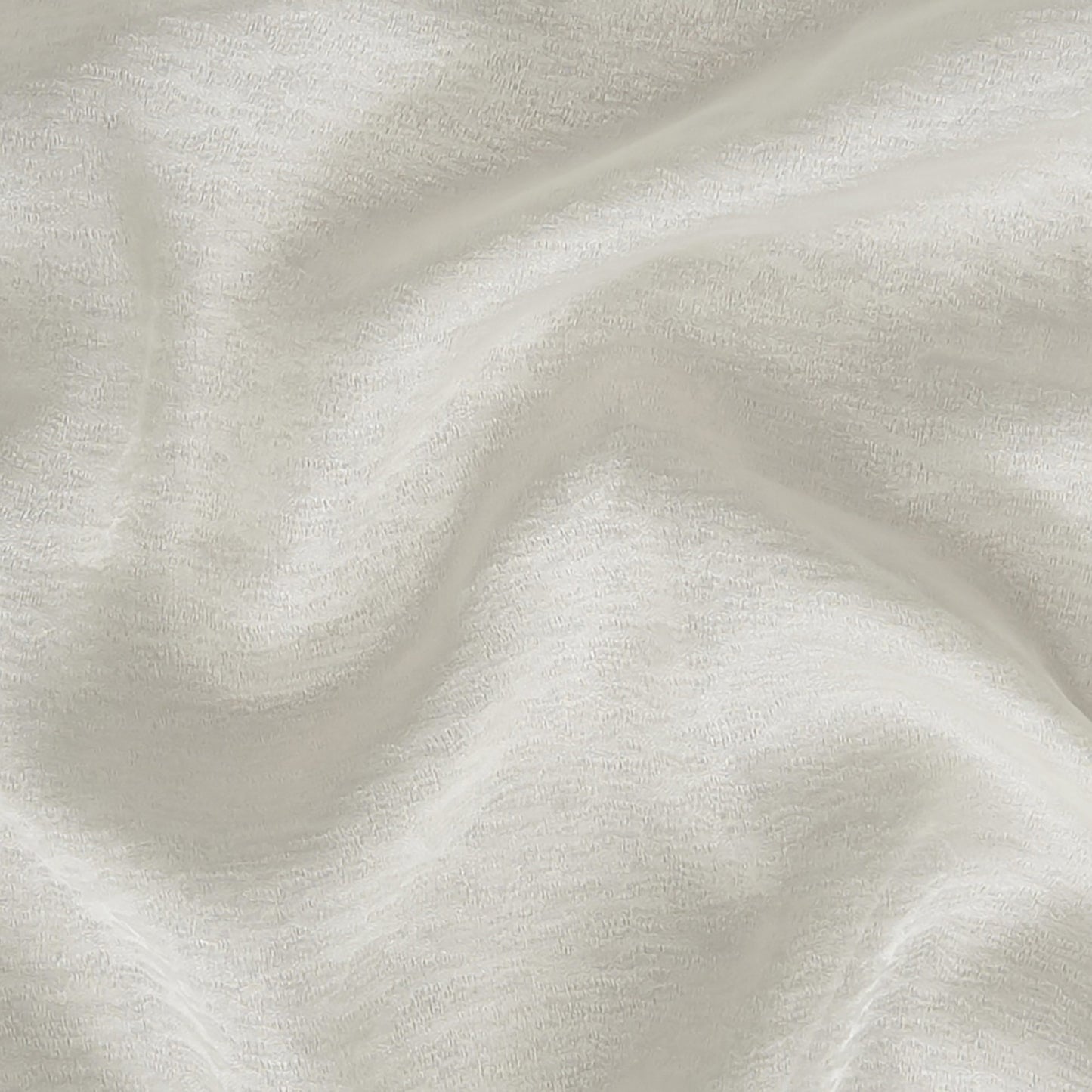 Creme/beige ripple-textured fabric with soft folds; lightweight, sheer jacquard fabric suitable for apparel or home decor; wide width.