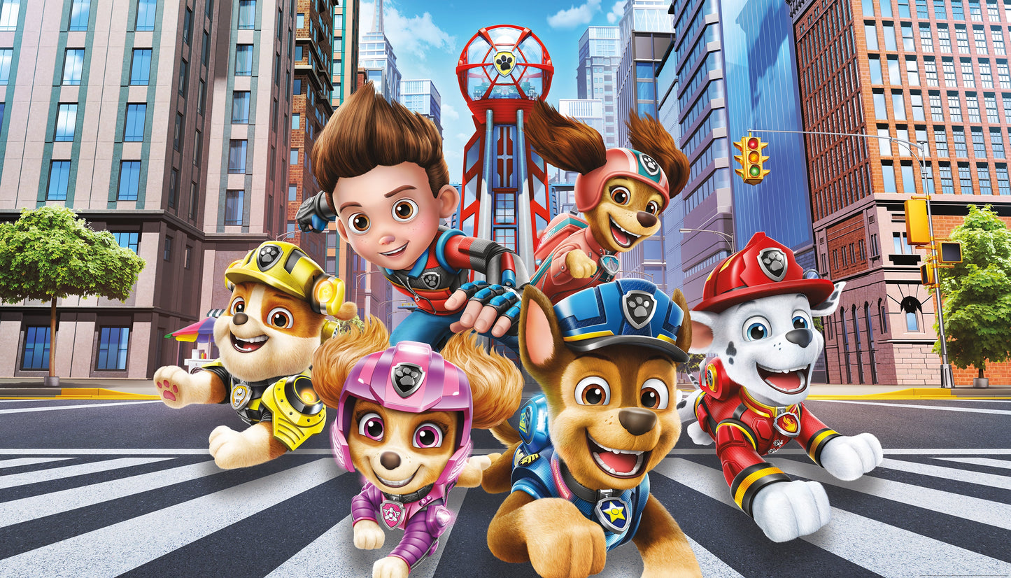 Colorful Paw Patrol pups in uniforms pose on a city crosswalk with tall buildings and a red hoop behind.