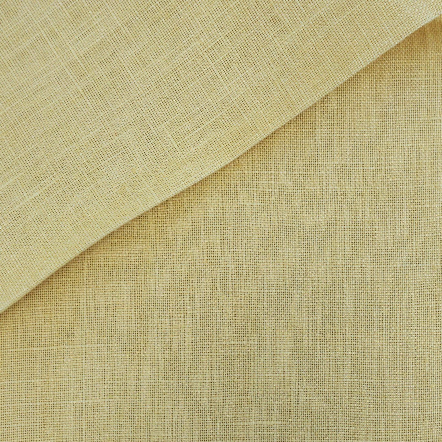 Beige linen-textured fabric with a lighter folded corner and warm natural tones.