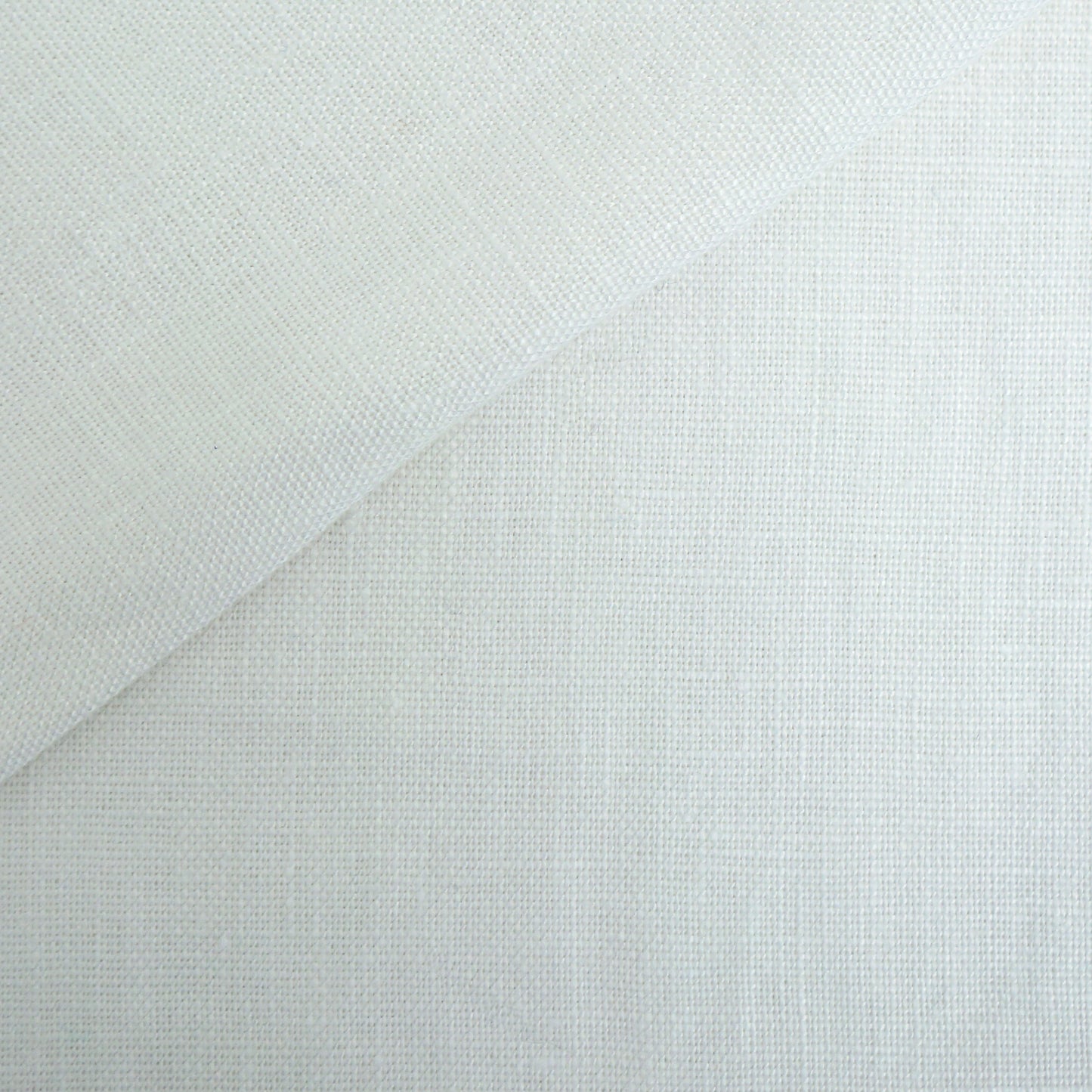 Off-white linen fabric with visible weave and a diagonal fold; versatile textile for drapery or garments.