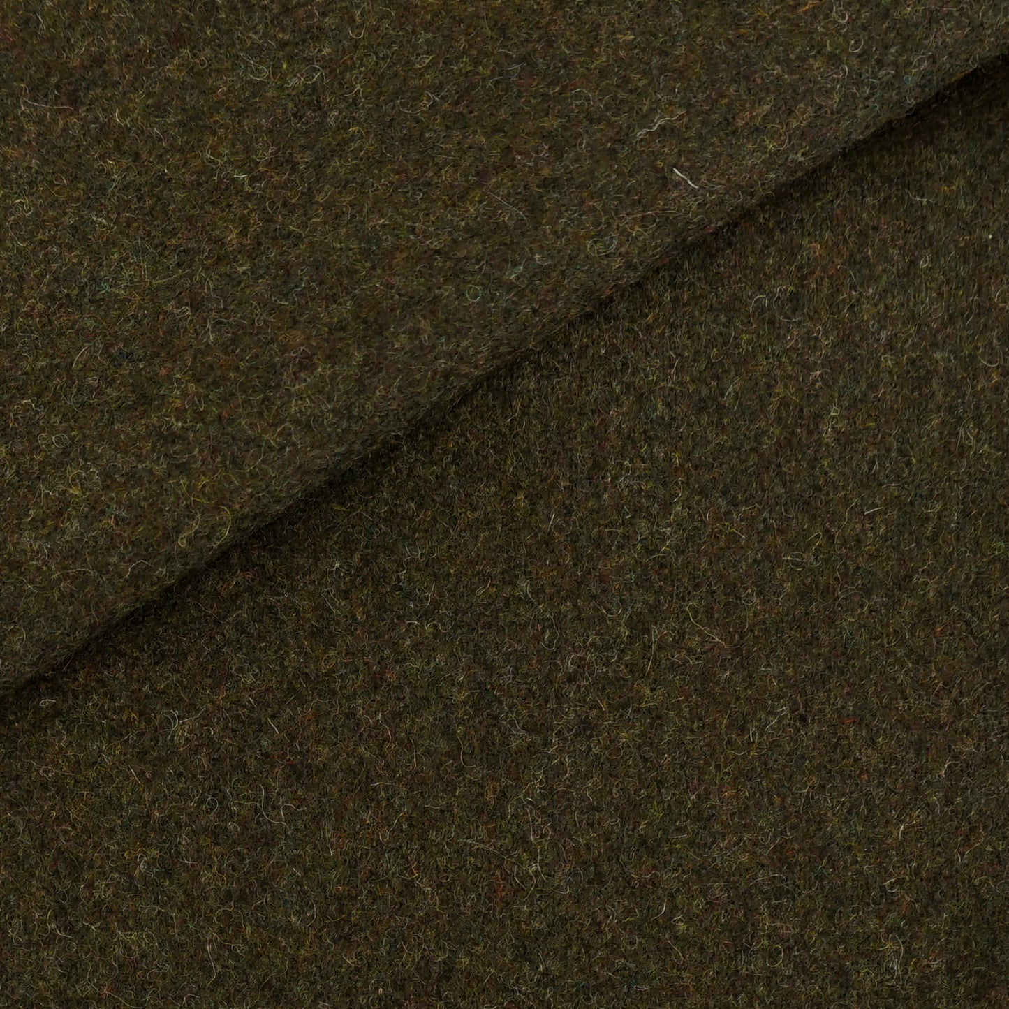 Plain brown wool fabric close-up with a diagonal seam; textured, soft felted weave for coats or outerwear.