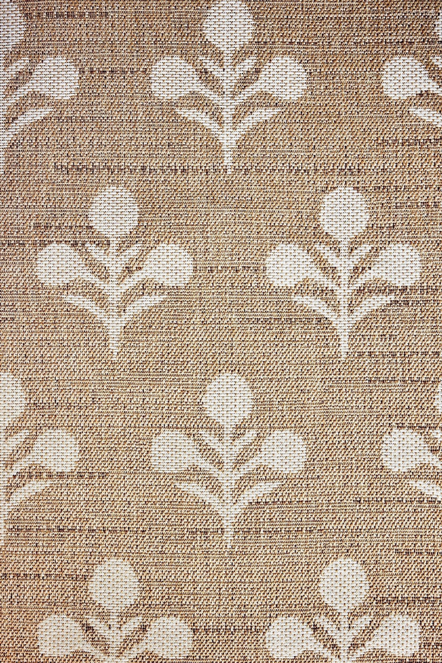 Beige woven rug with a white stylized floral trellis pattern; rustic, textured textile suitable for floors.