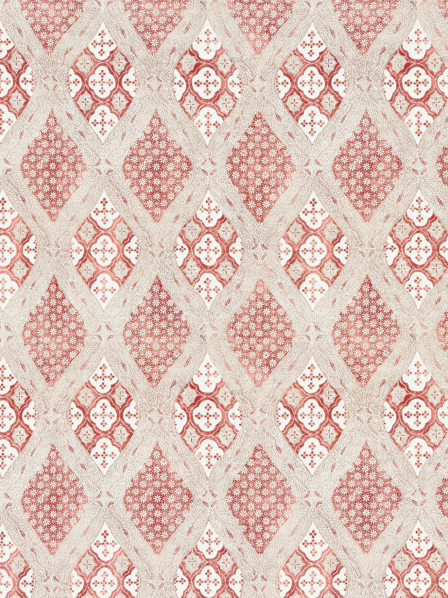 Cream and red damask wallpaper with interlocking diamond medallions and floral motifs.