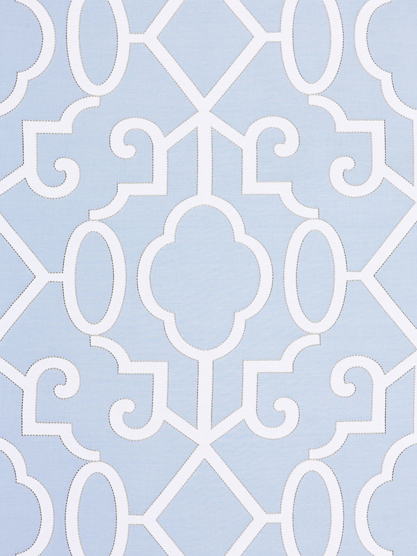 Light blue fabric with white stitched-edged geometric quatrefoil lattice pattern; modern Moroccan tile style.
