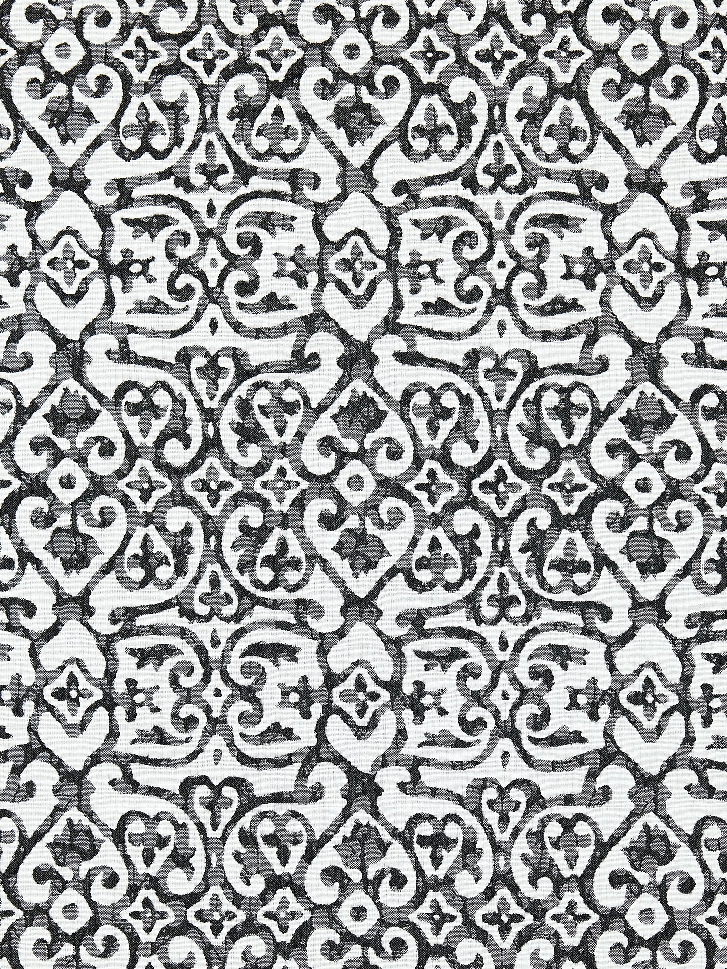 Black and white damask pattern with ornate scrolling floral motifs and repeating tile elements for wallpaper or fabric.