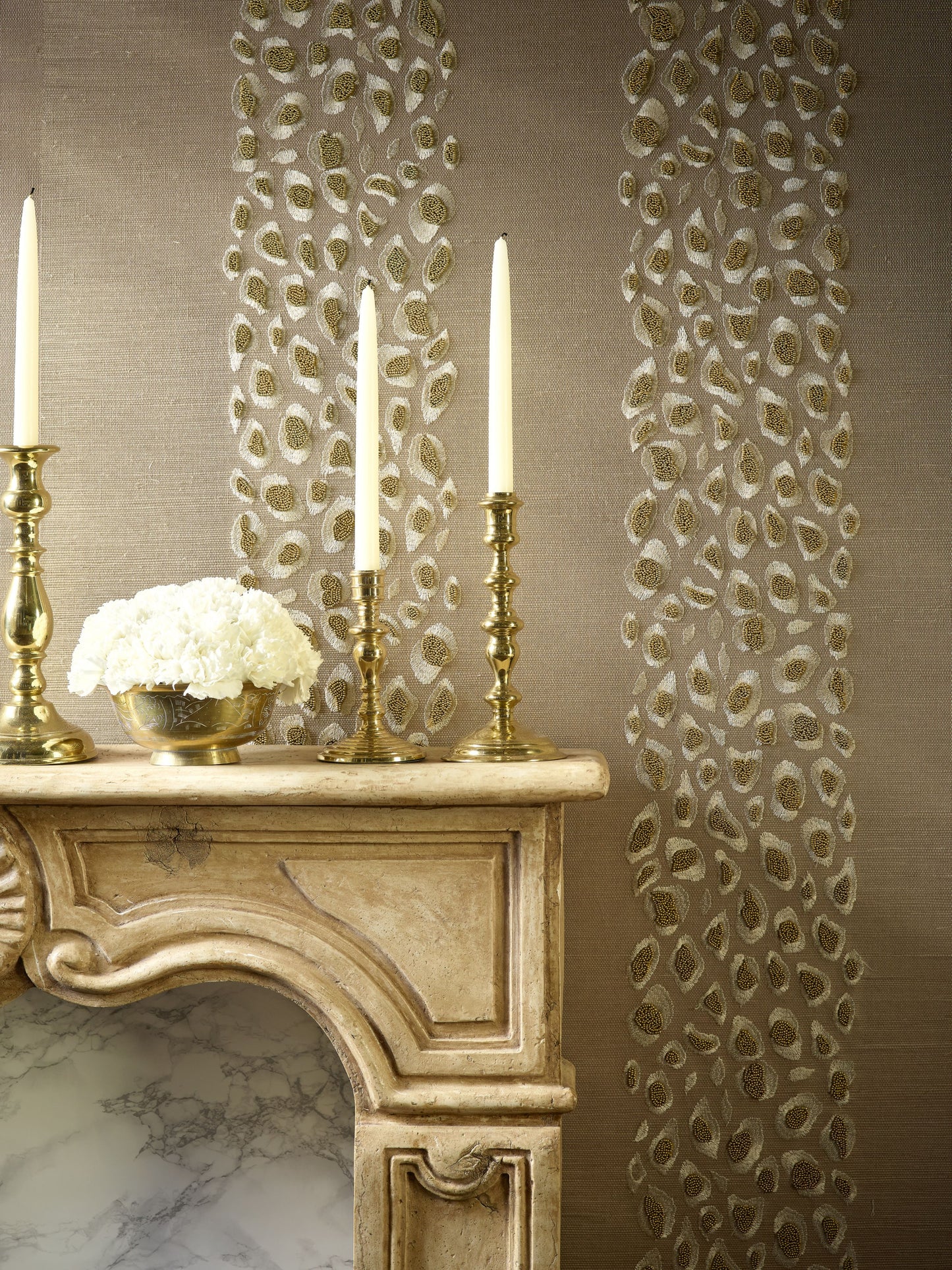 Beige grasscloth wallpaper with a desert-toned animal-skin stripe pattern.
