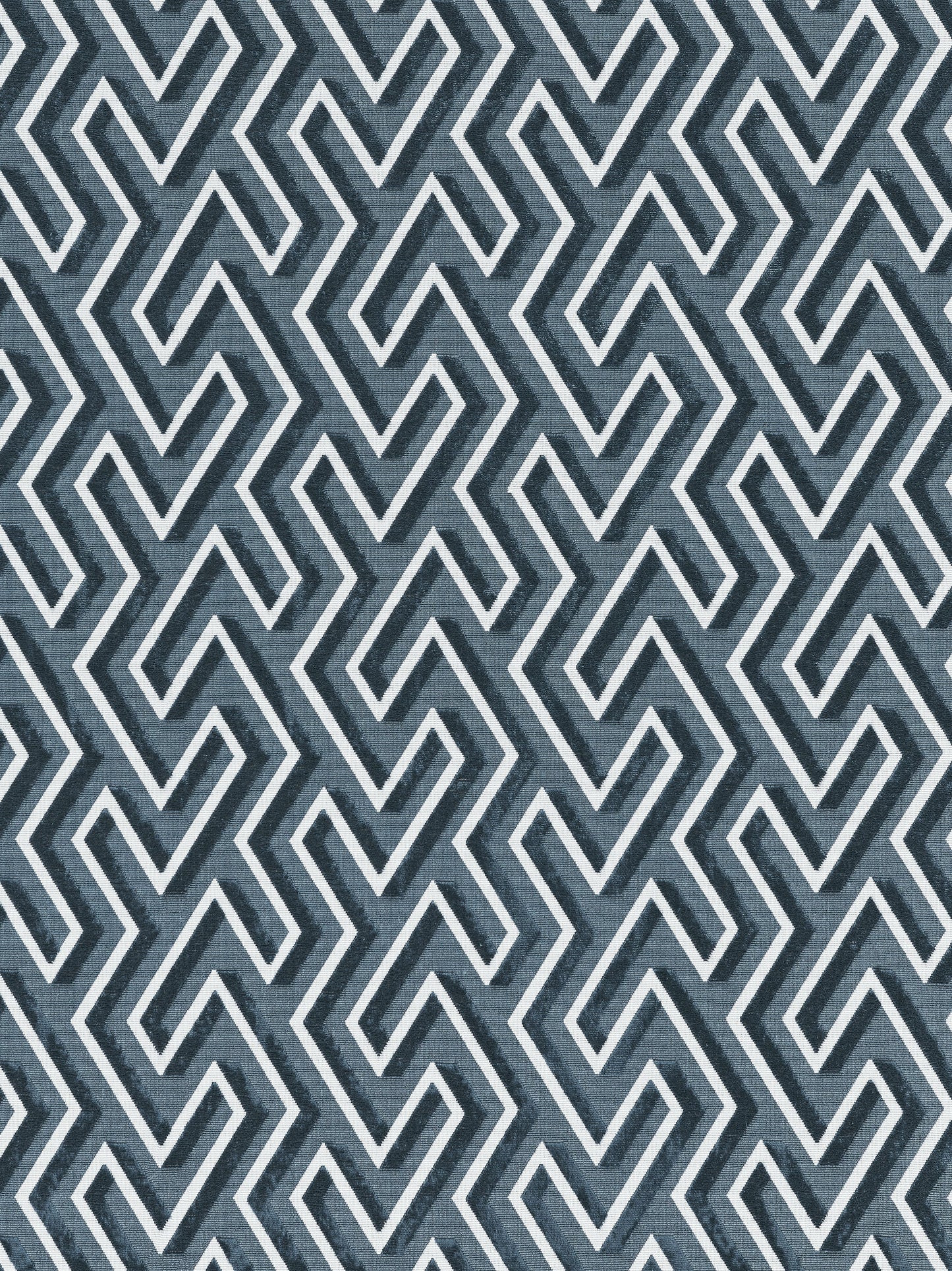 Blue-gray fabric with white interlocking zigzag/Greek-key pattern; modern geometric textile.