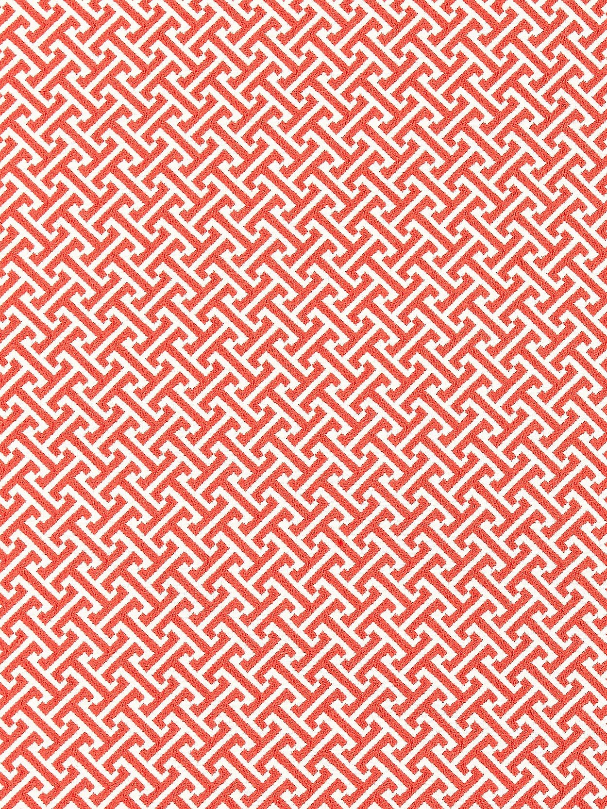 Red and white interlocking Greek-key lattice pattern fabric texture.