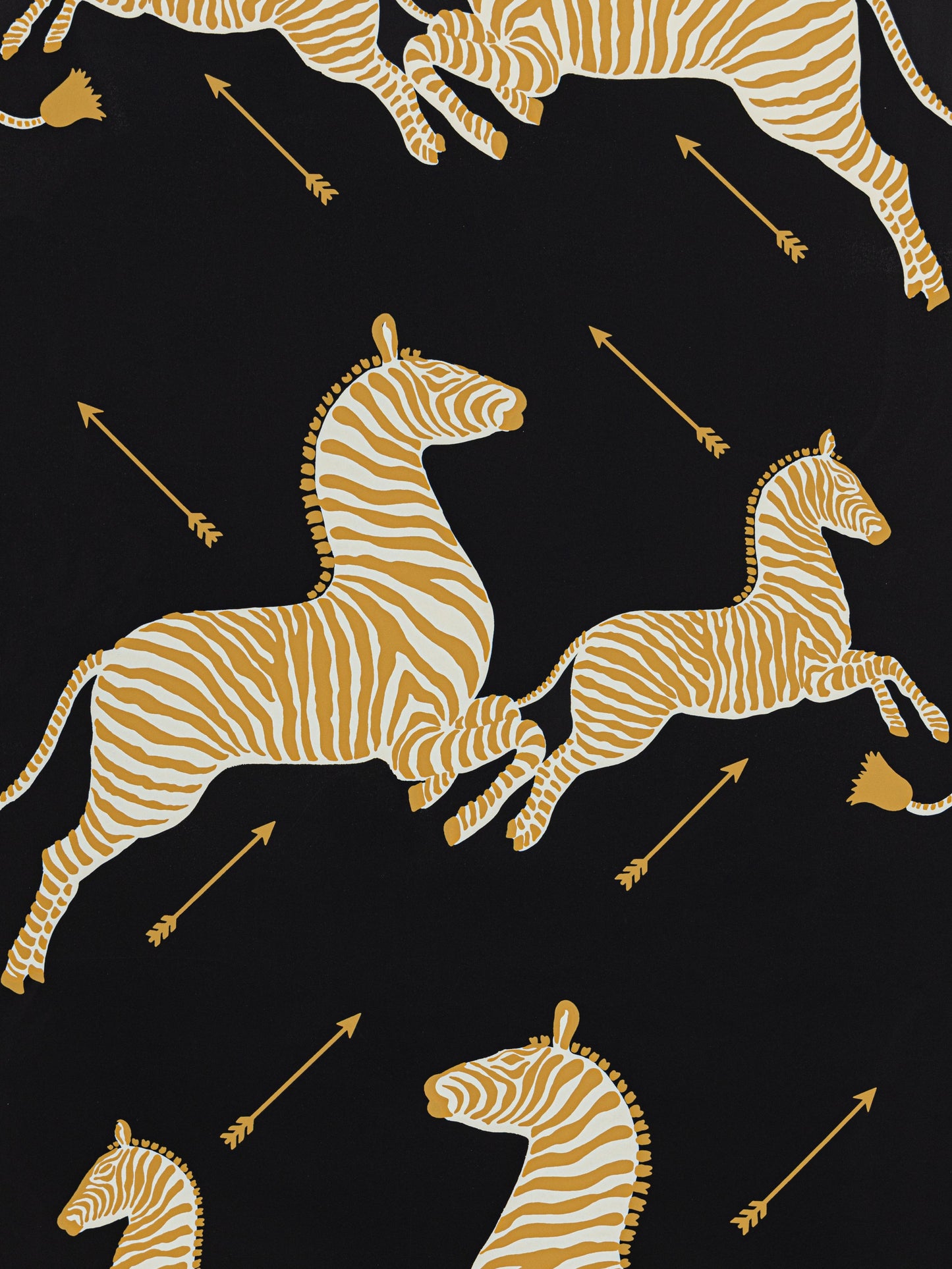 Gold zebra print on black background with arrows; bold textile fabric pattern.