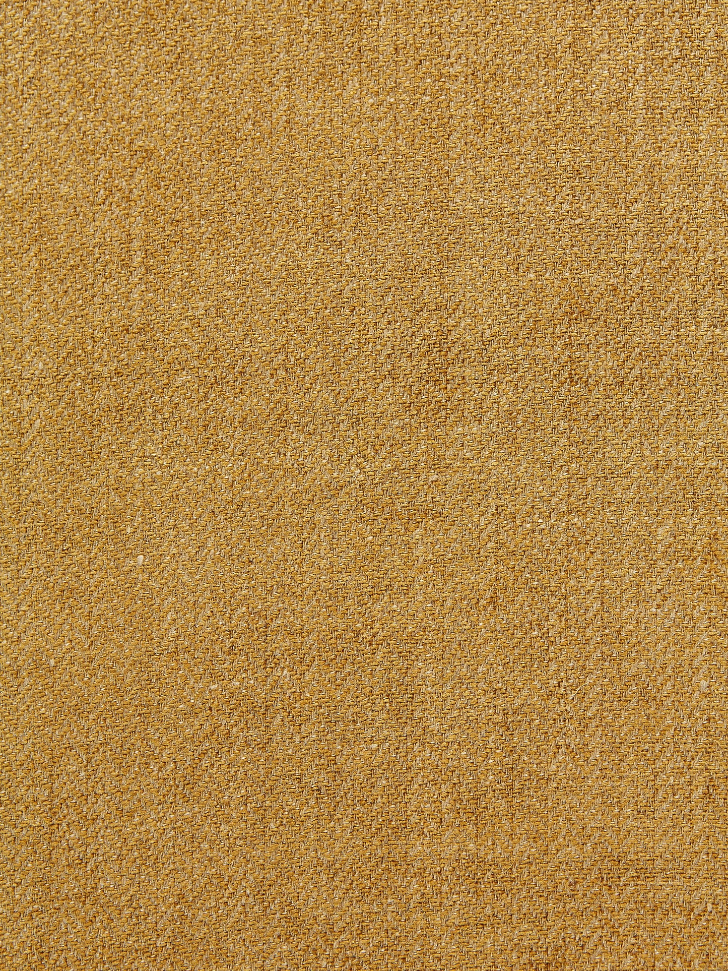 Mustard-gold boucle fabric with soft, nubby texture; ideal for upholstery or jackets.
